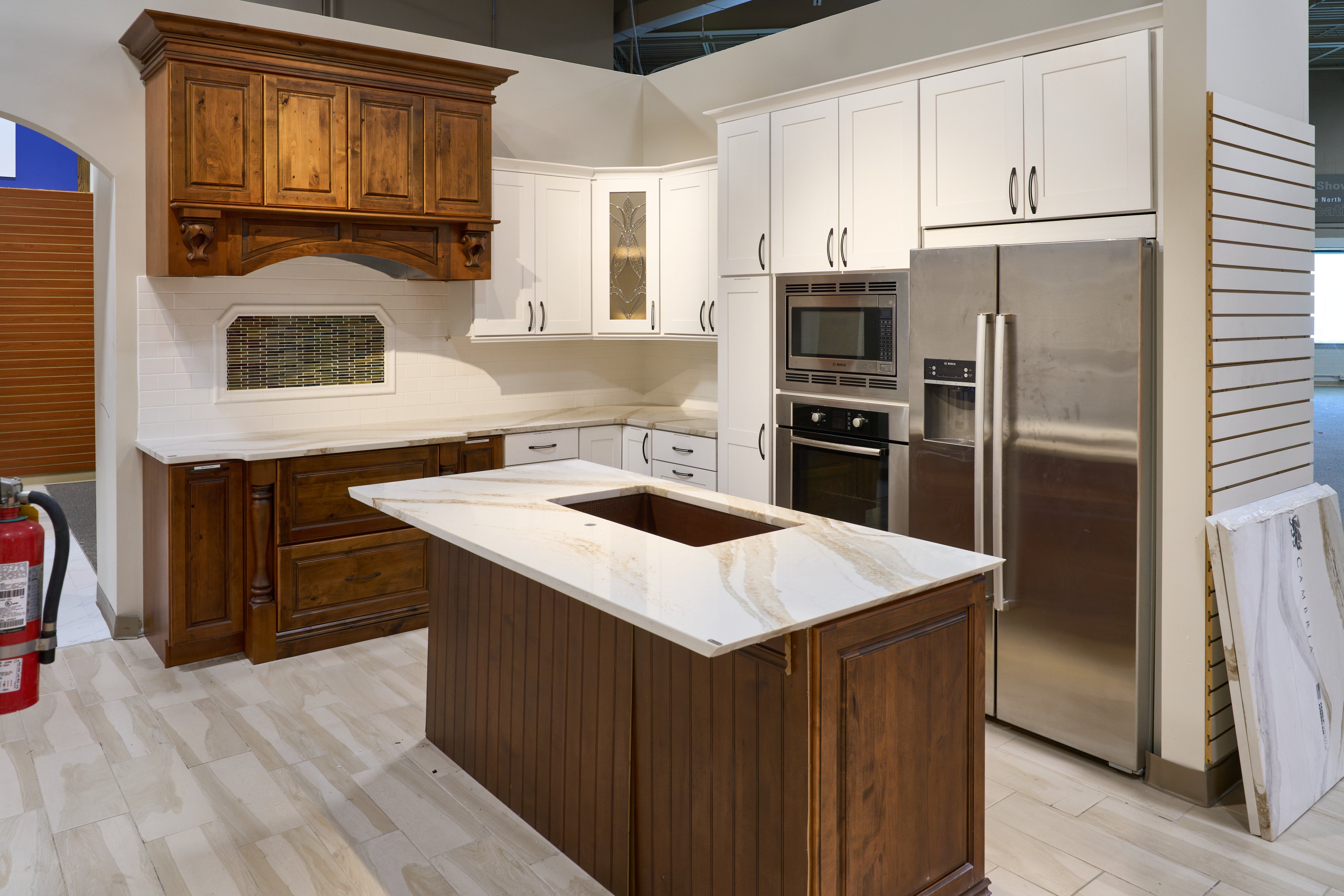 The Brentwood transitional white wood kitchen with island and appliances