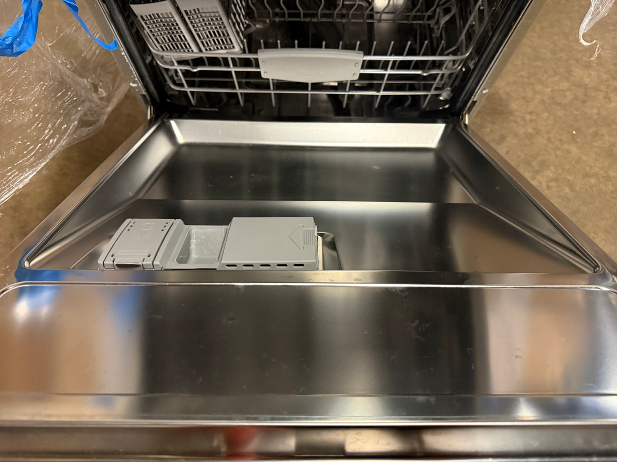 Open stainless steel dishwasher with the door swung open, showing the interior racks, detergent dispenser area, and upper tub rim.