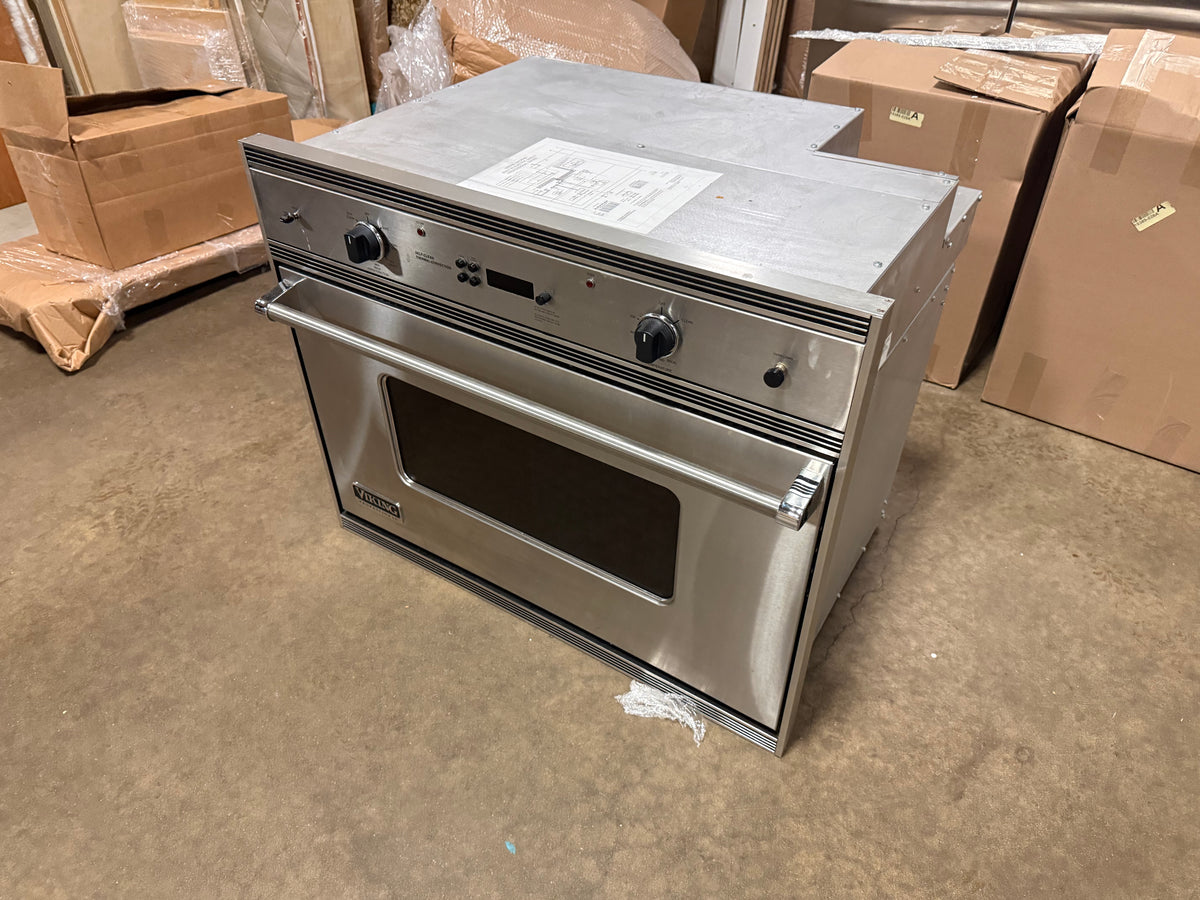 High-end stainless steel residential wall oven with digital timer and control knobs