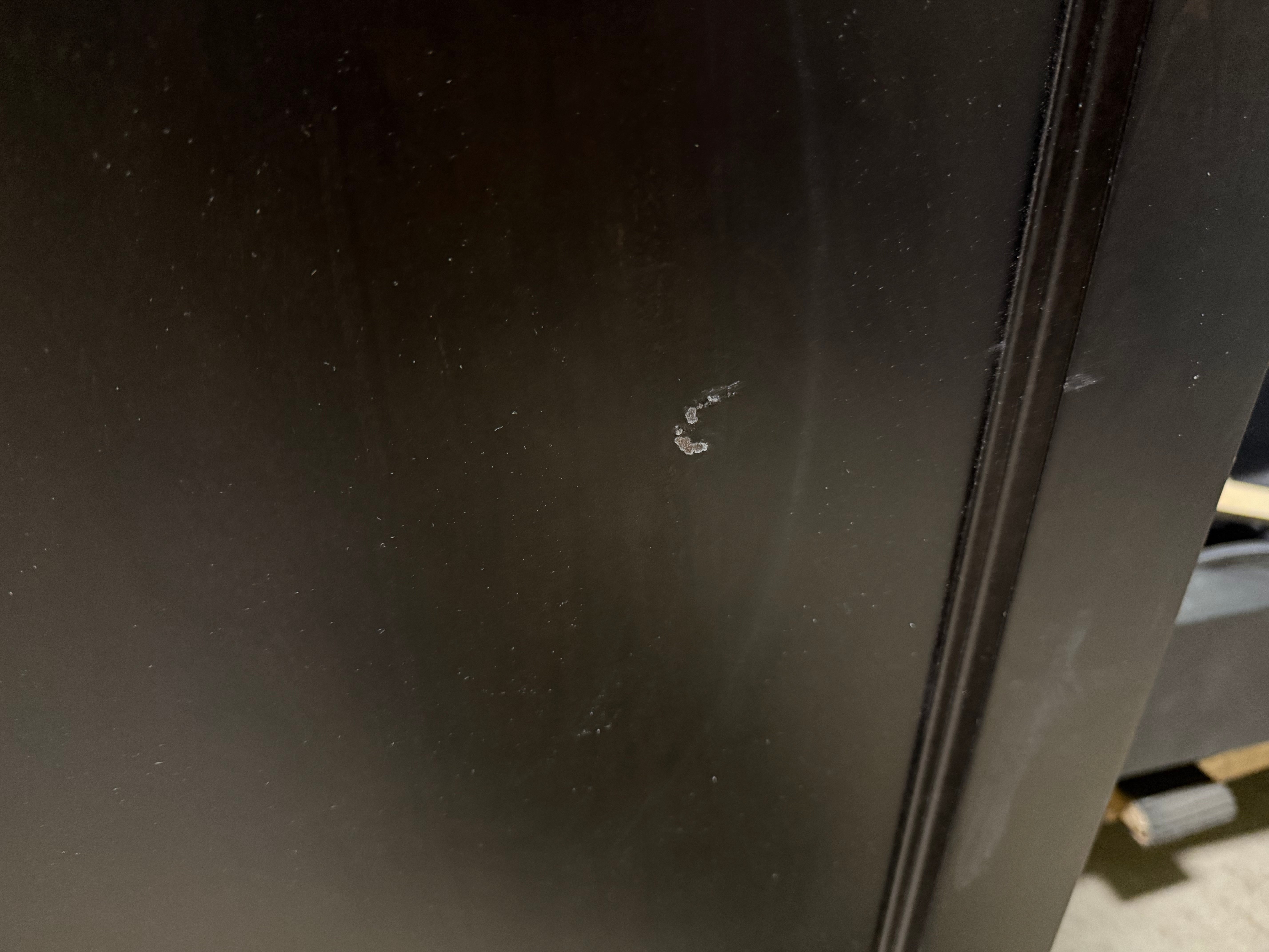 Scratch on a black surface