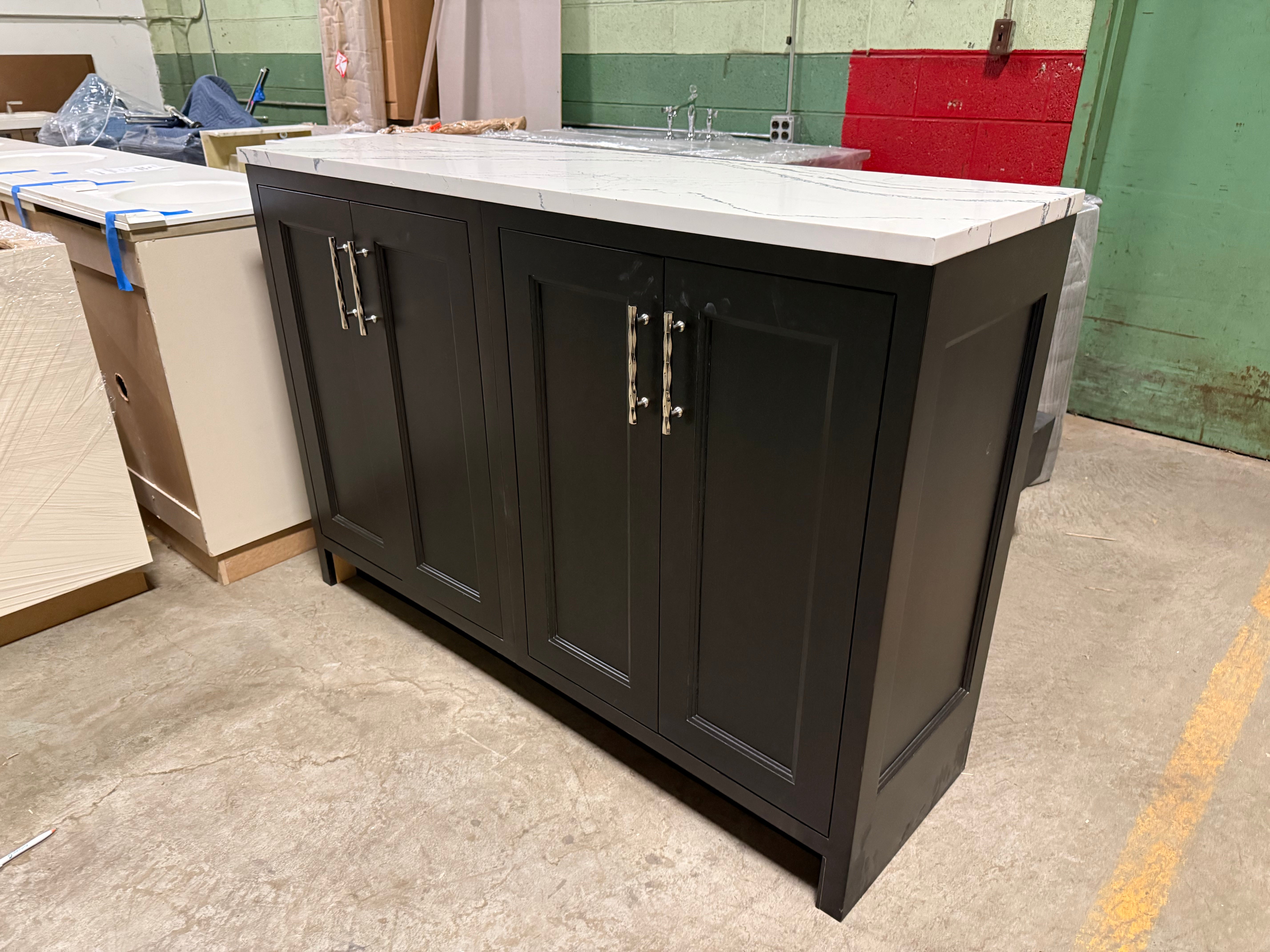 Dark wooden kitchen island with white countertop in a warehouse setting