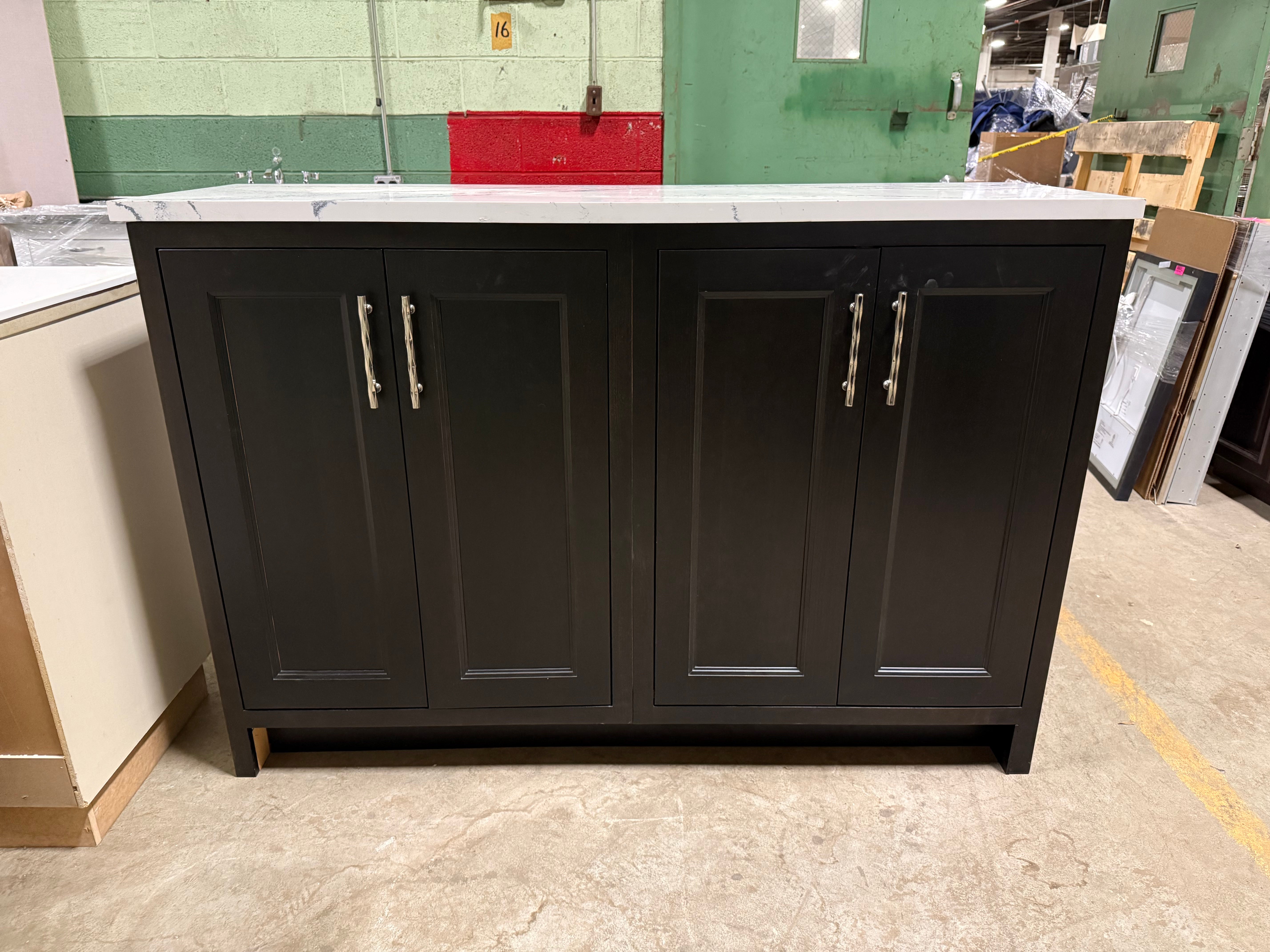 Black cabinet with white countertop in a warehouse setting