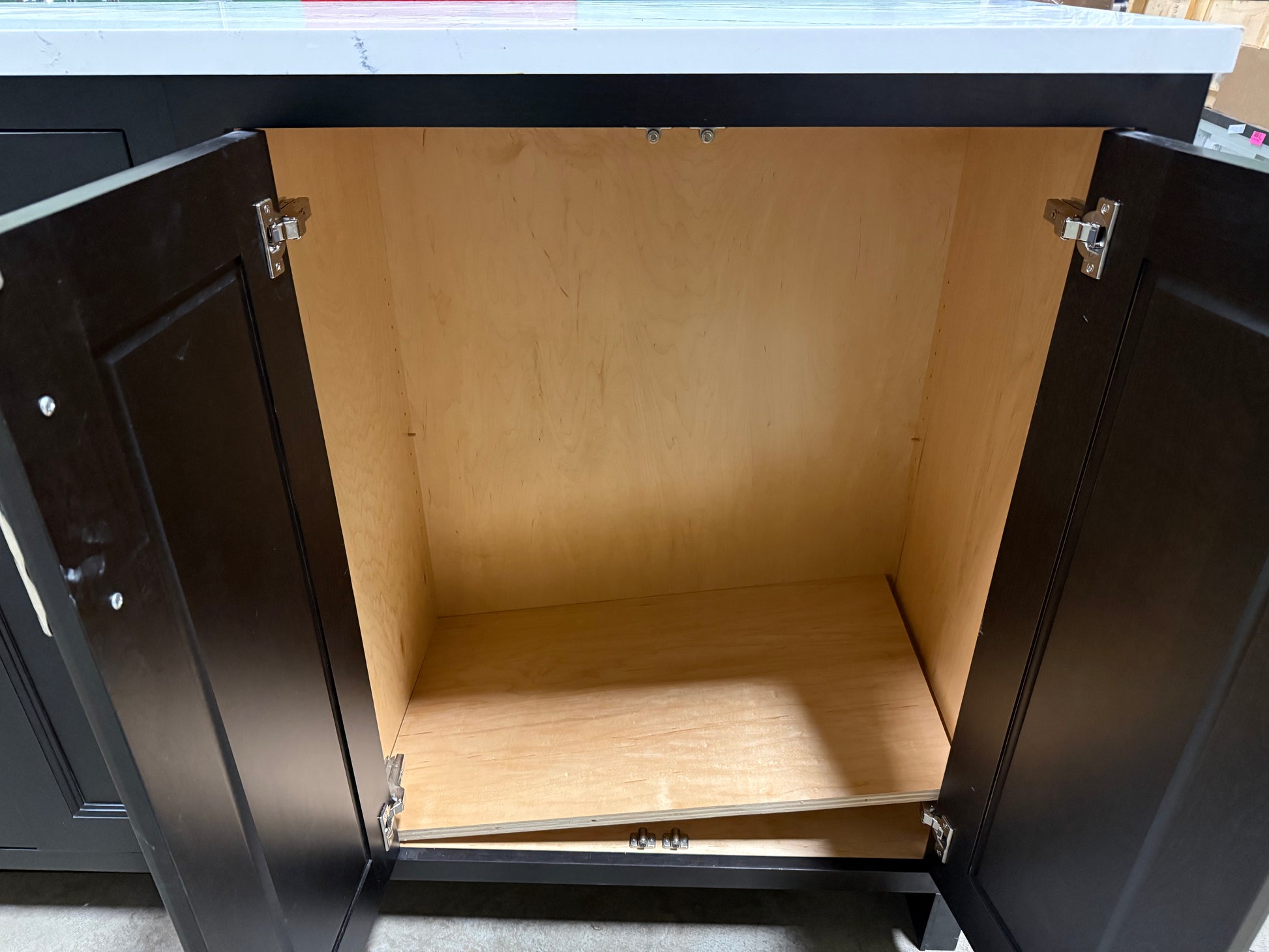 Open cabinet with wooden interior and metal frame