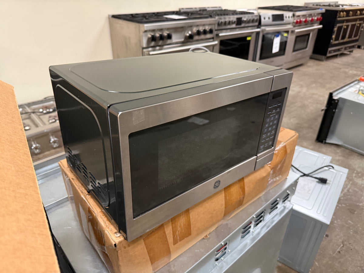 Modern stainless steel countertop microwave for small spaces or offices