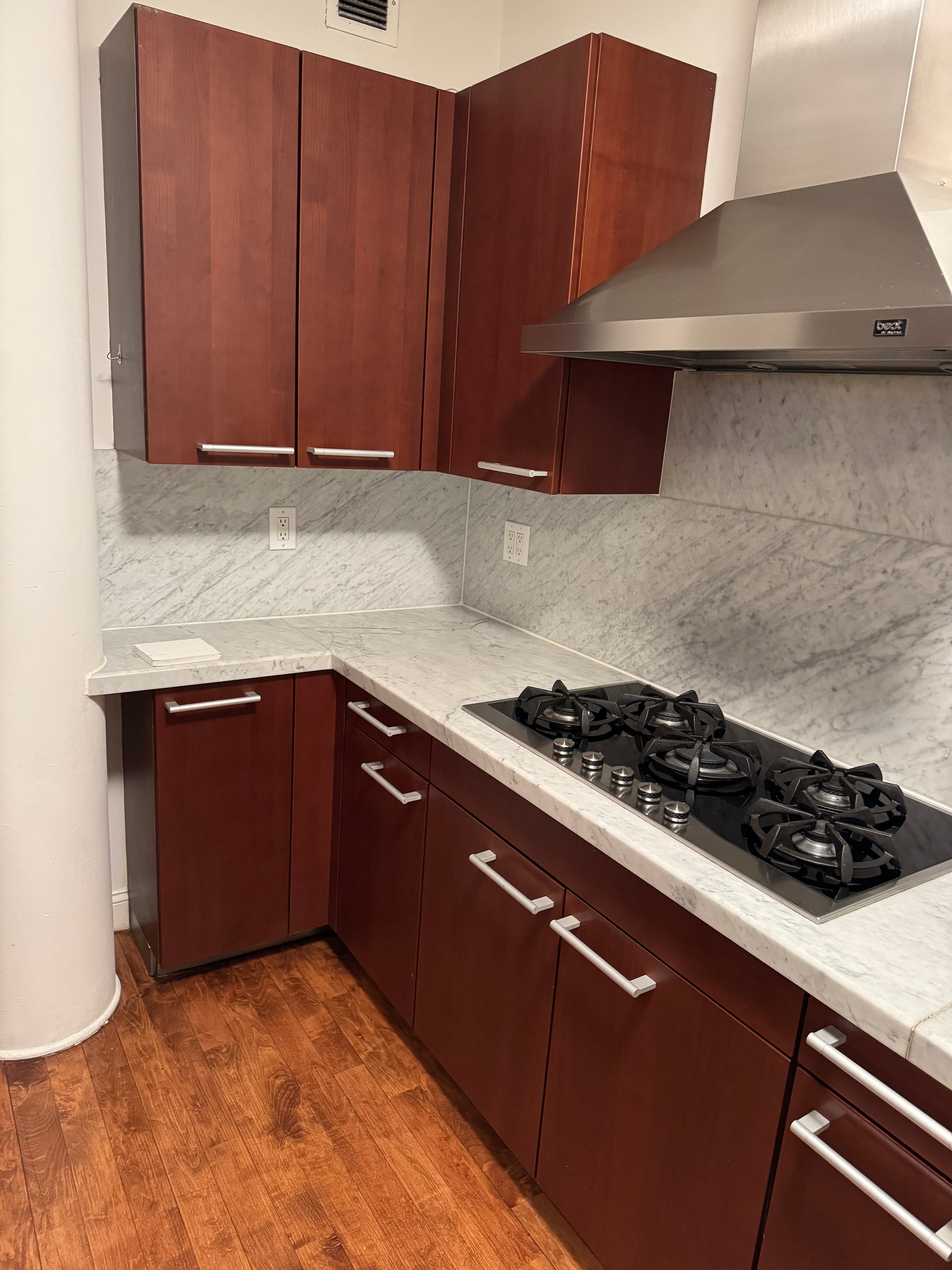 Poggenpohl Brown Toned Transitional Kitchen with Marble Countertops and Appliances