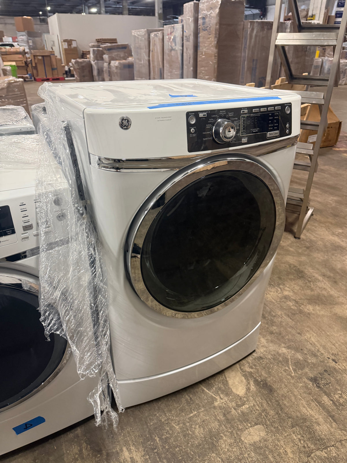 Luxury ergonomic white front load dryer with built in pedestal and steam refresh