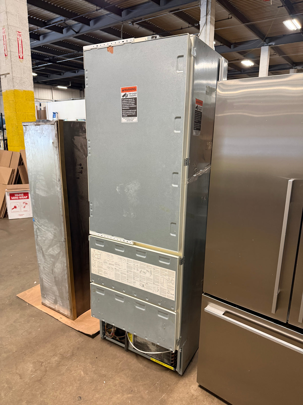 High end custom cabinetry integrated Sub Zero 700 series refrigerator