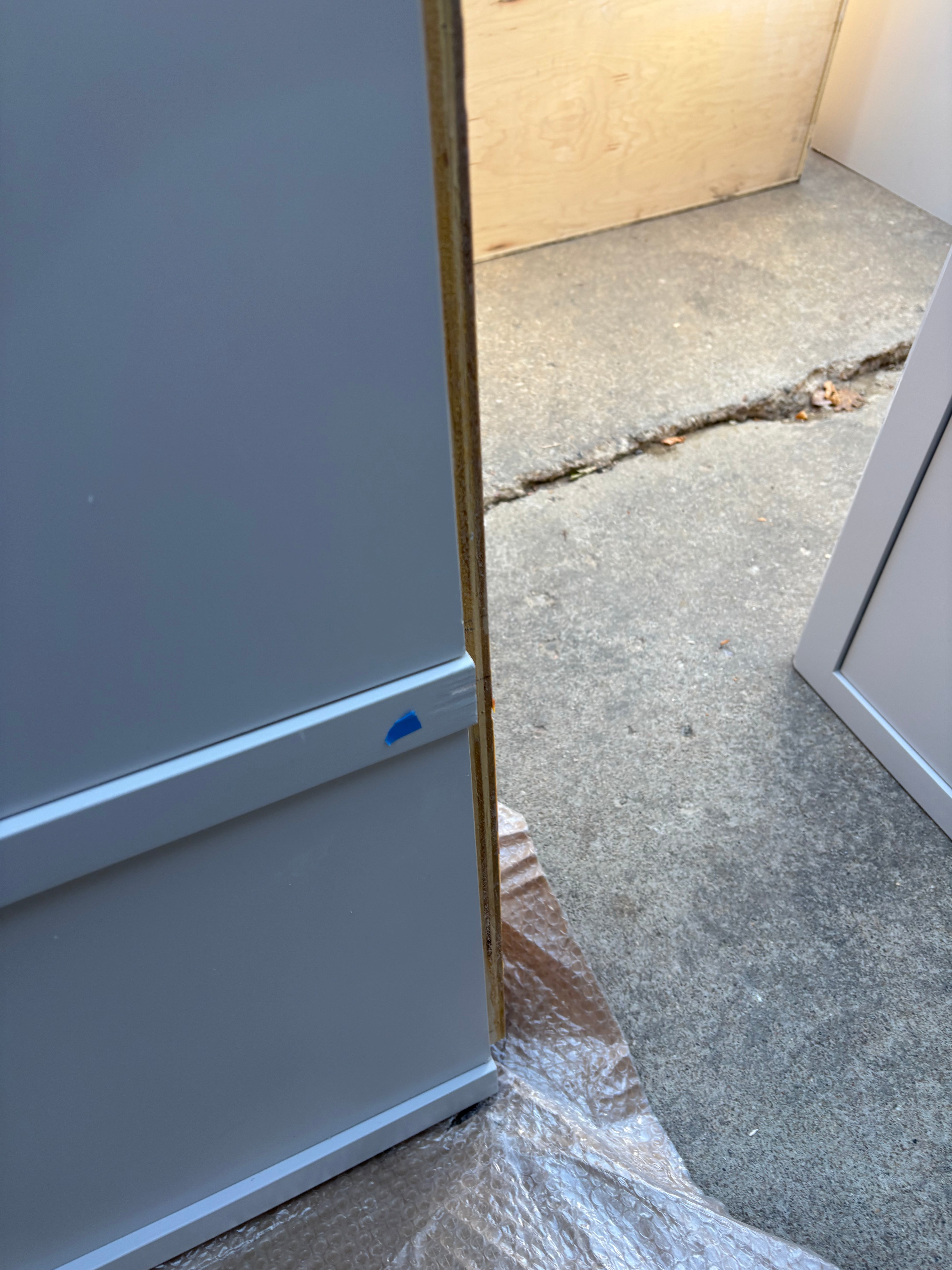 Custom Modern Light Grey Pantry with White Stone Countertops and Stainless Steel Sink
