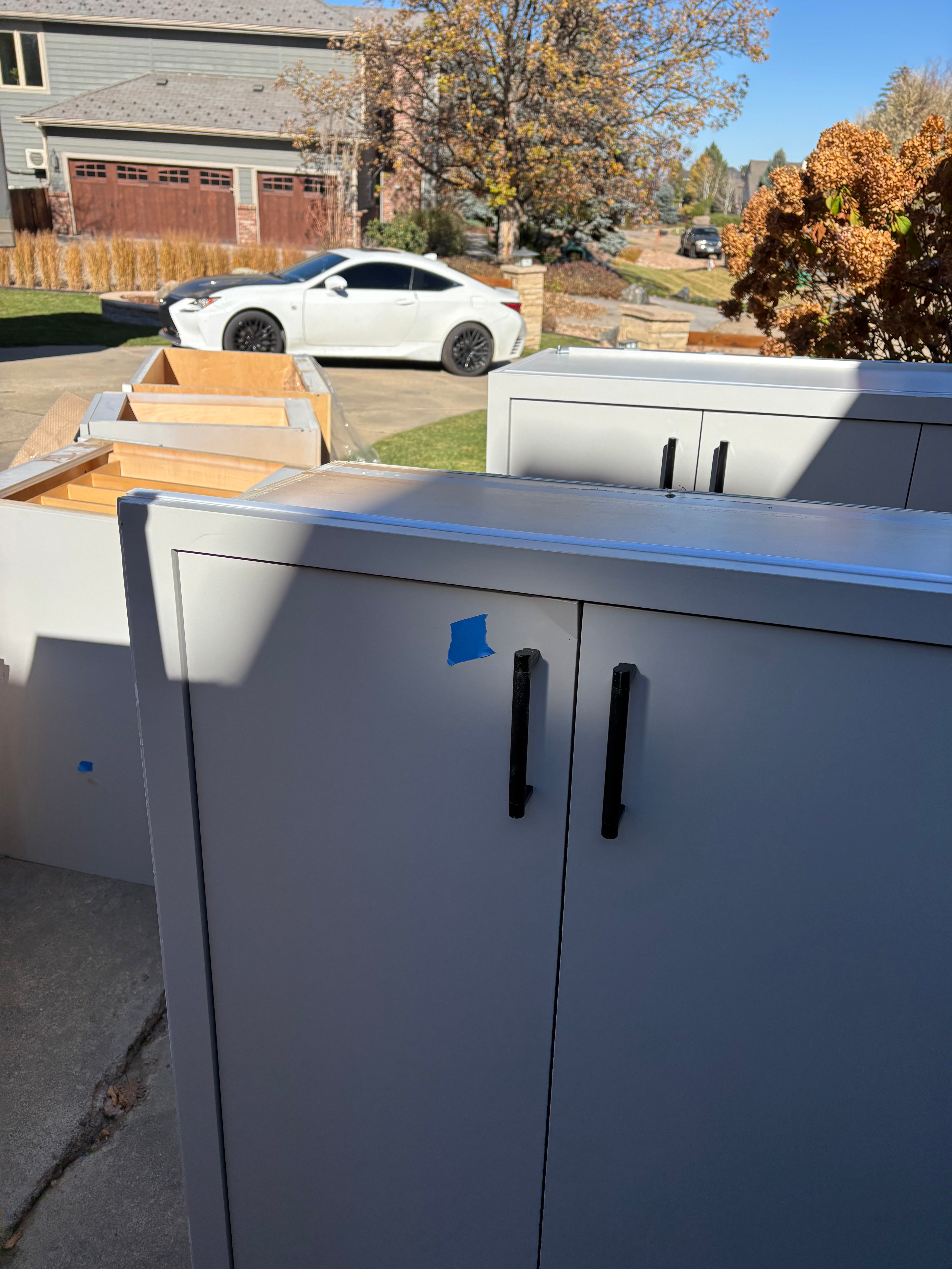 Custom Modern Light Grey Pantry with White Stone Countertops and Stainless Steel Sink