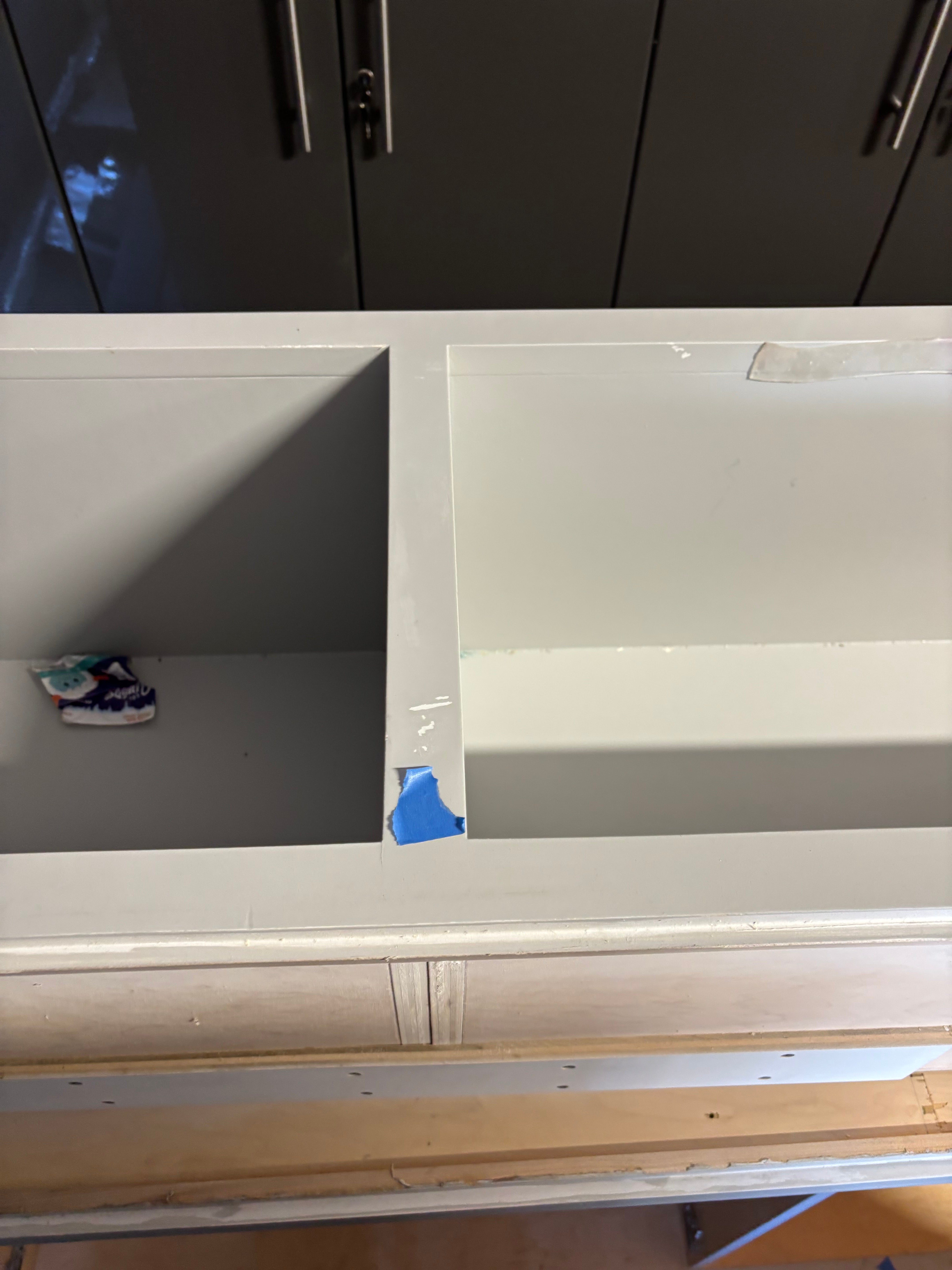 Custom Modern Light Grey Pantry with White Stone Countertops and Stainless Steel Sink