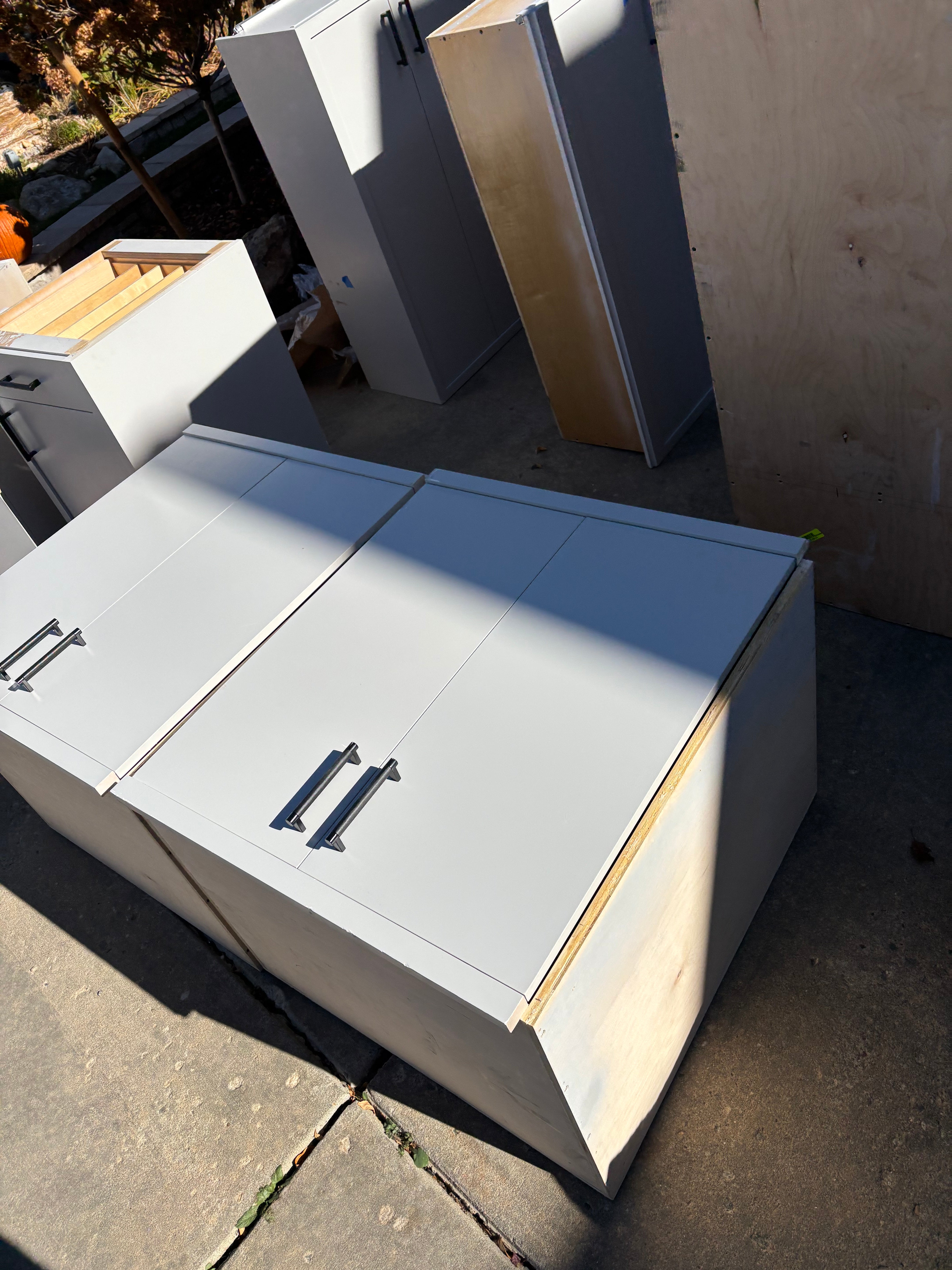 Custom Modern Light Grey Pantry with White Stone Countertops and Stainless Steel Sink
