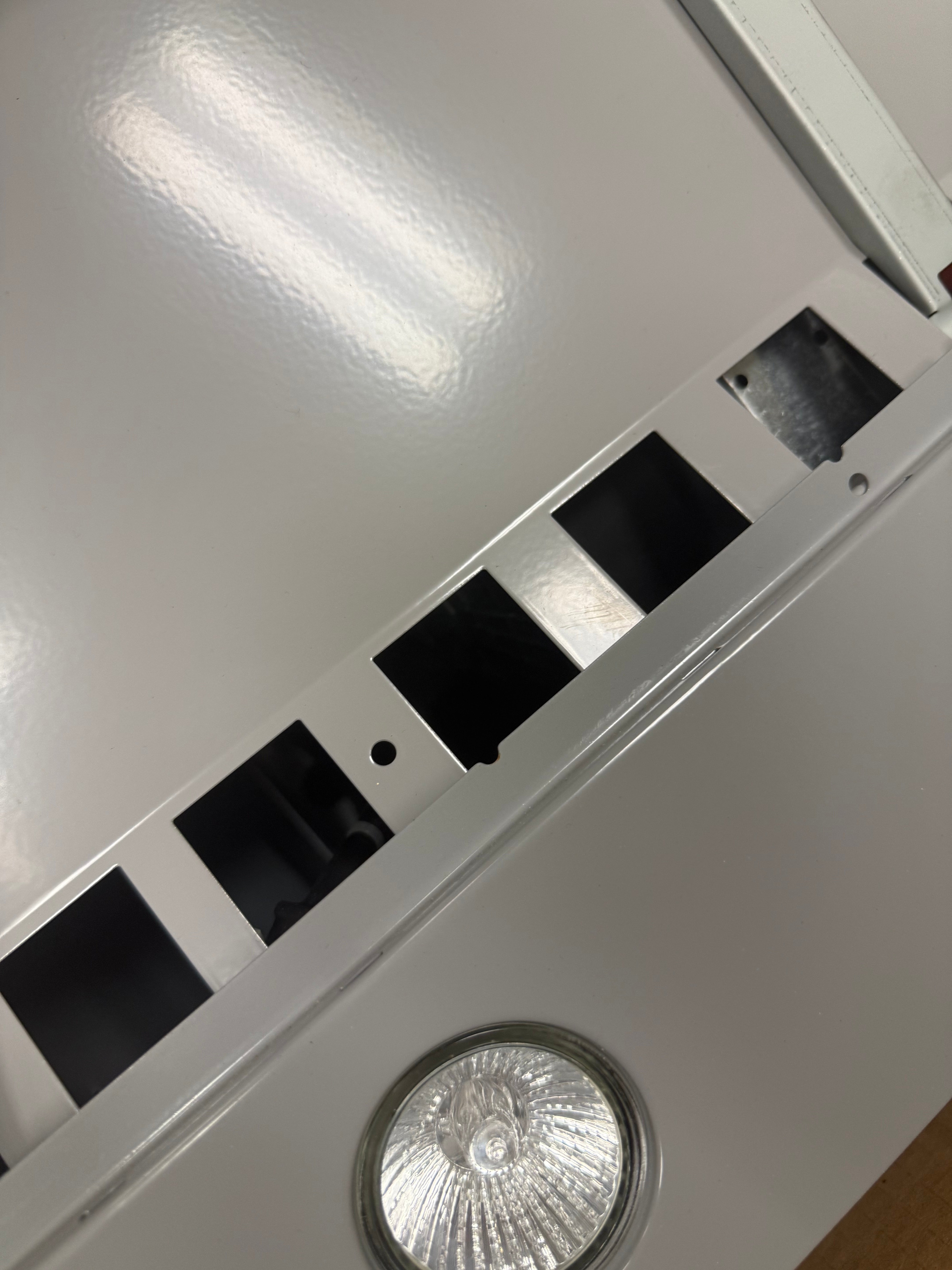 Close up of XO XOC30SMUA retracting slide out visor and illuminated controls