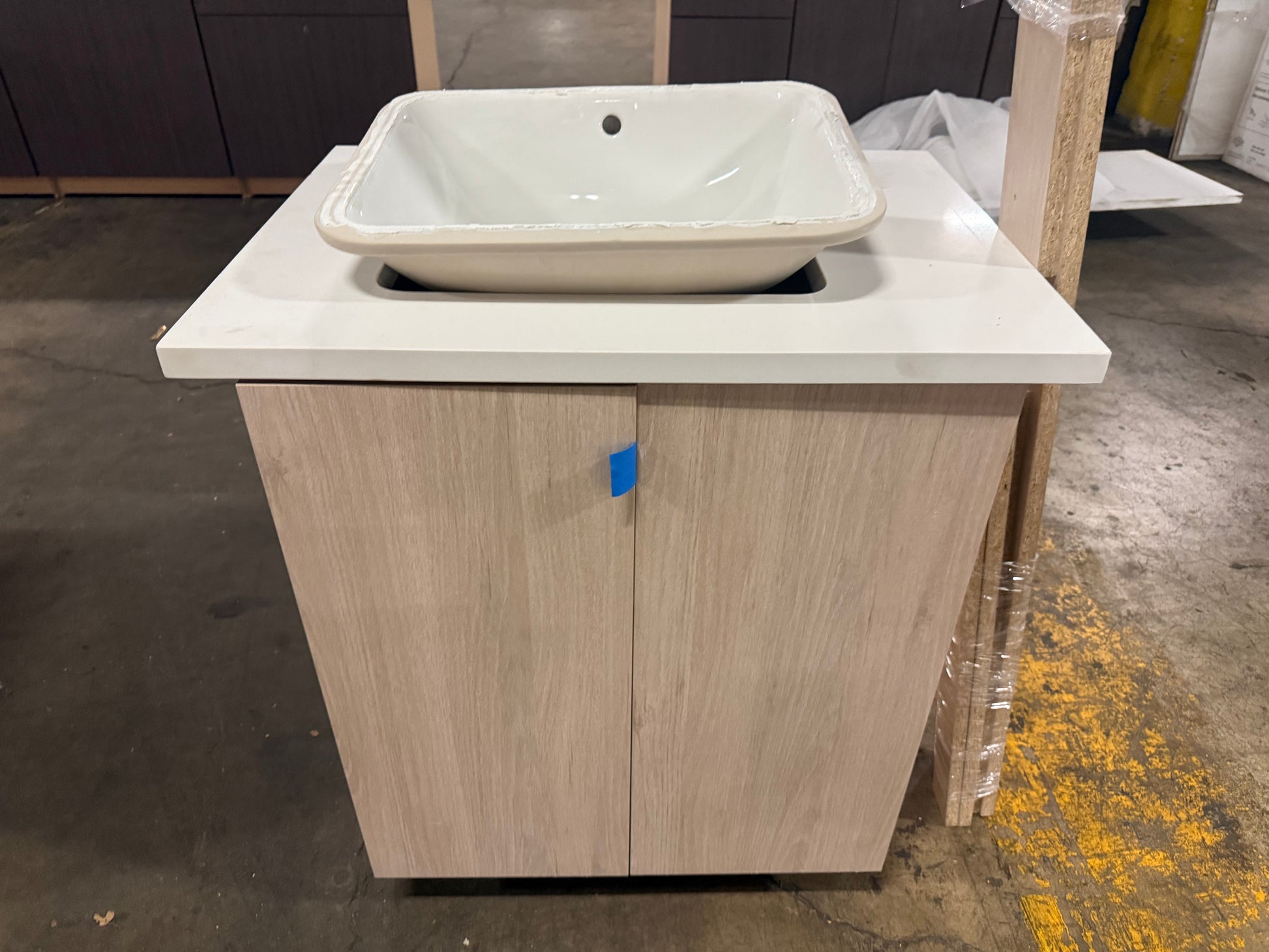 Cabico 27 inch sandy oak wood grain laminate single vanity cabinet