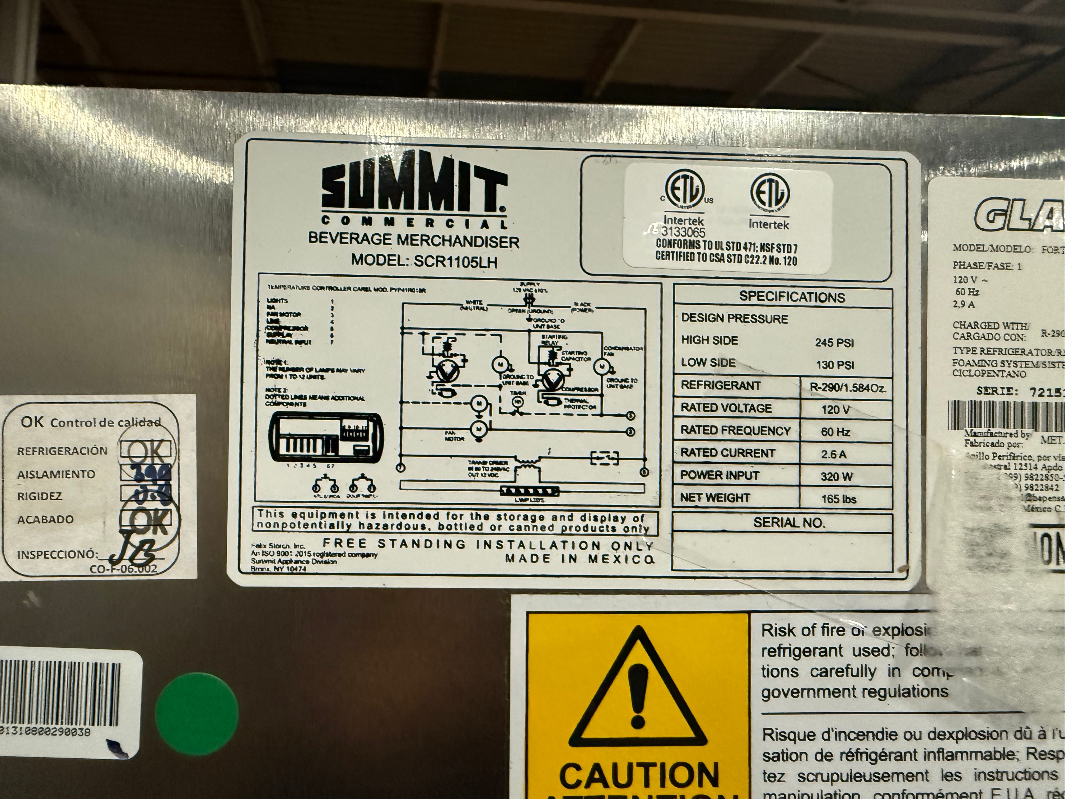 A close-up of a metal product label panel showing a Summit Commercial beverage merchandiser specification sheet, model SCR110SL, with technical specs, a wiring diagram, and a yellow caution label.