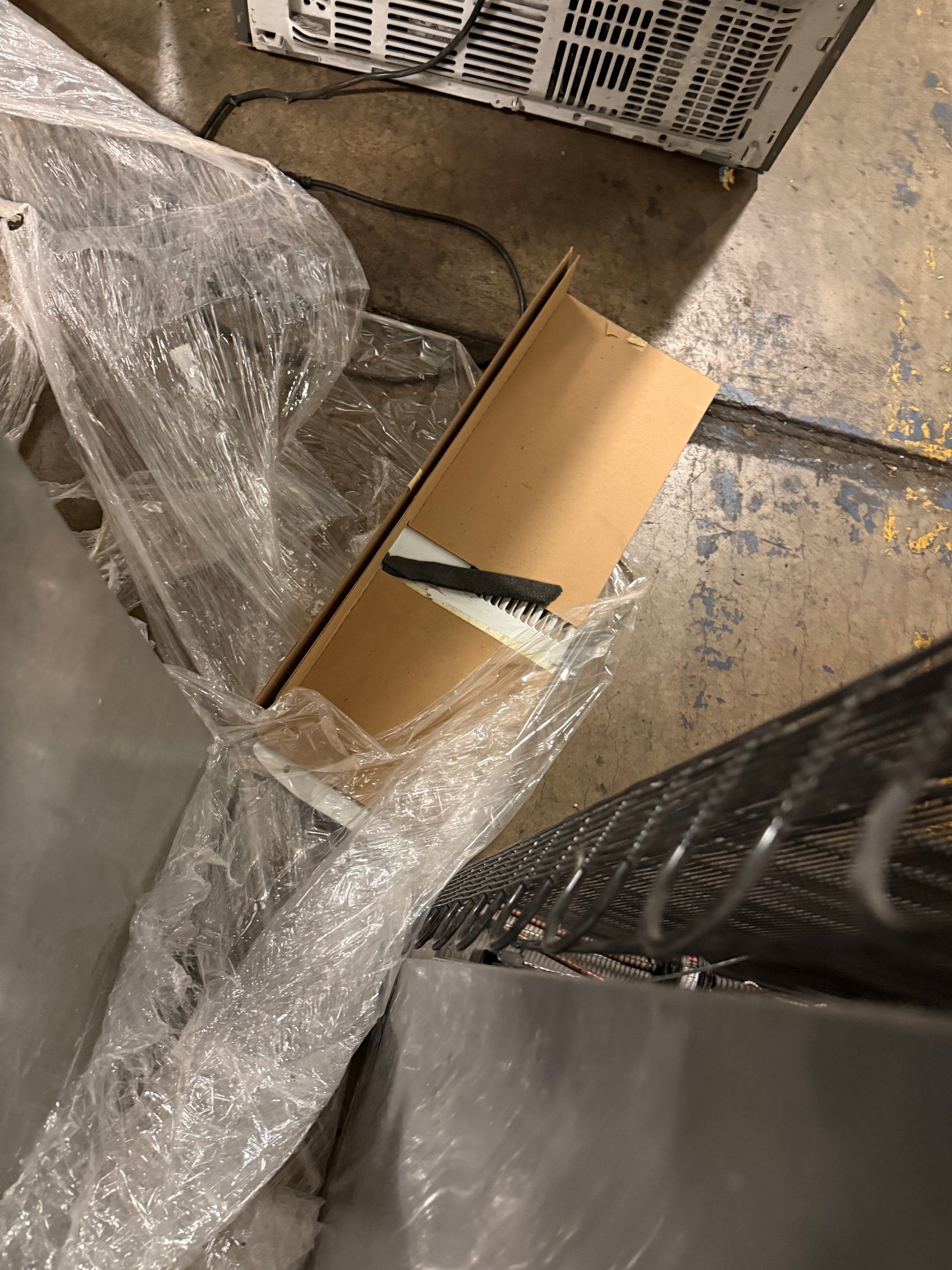 Custom integrated Sub-Zero 27 in column fridge with lower glass wine door