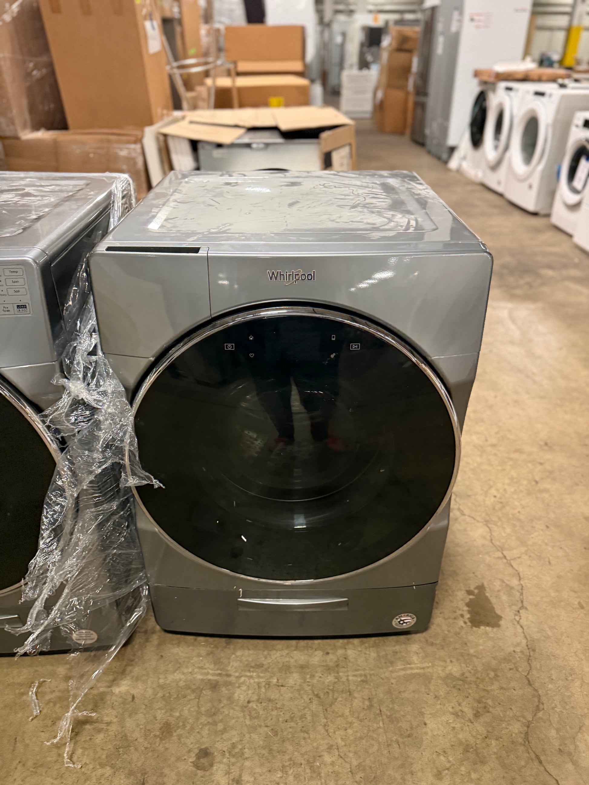 Whirlpool smart front load washer with Load and Go XL bulk detergent dispenser