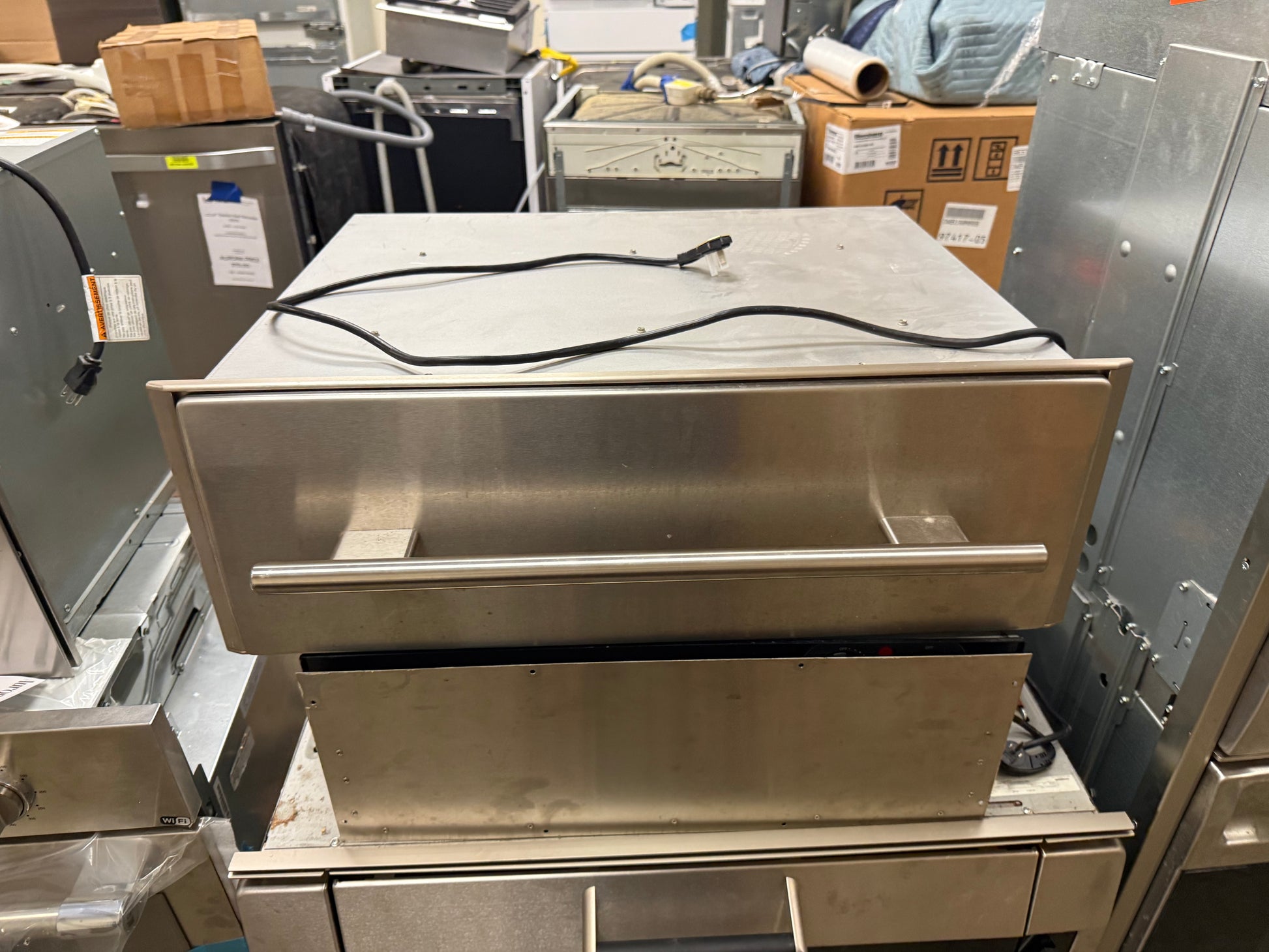 Luxury built-in stainless steel warming drawer for high-end kitchens