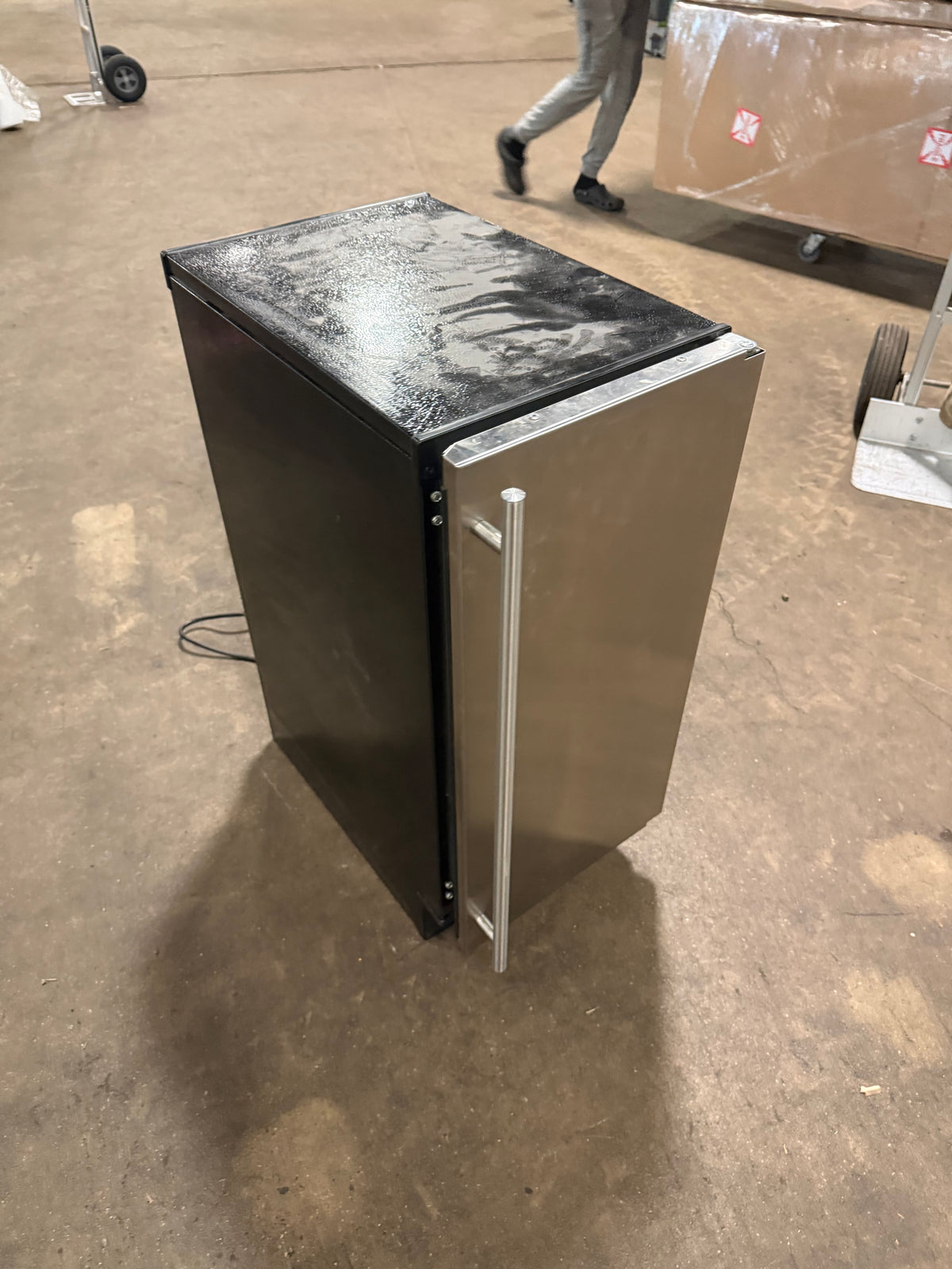 High-end residential bar appliance with stainless door and interior bin light
