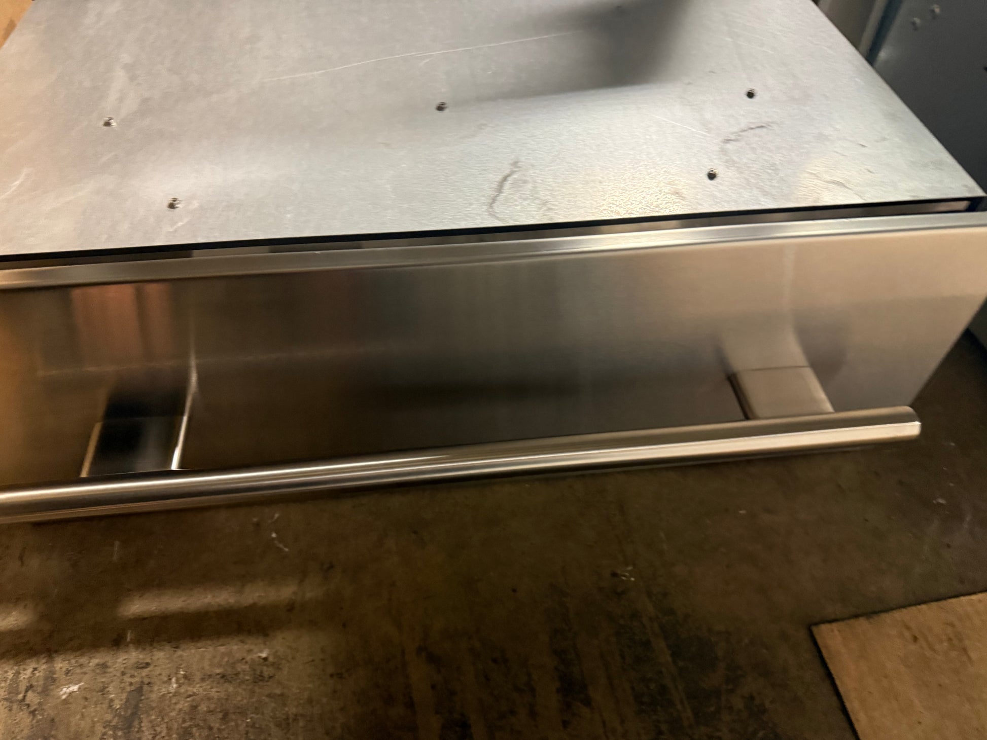 High-end Sub Zero Wolf kitchen warming drawer with hidden electronic controls