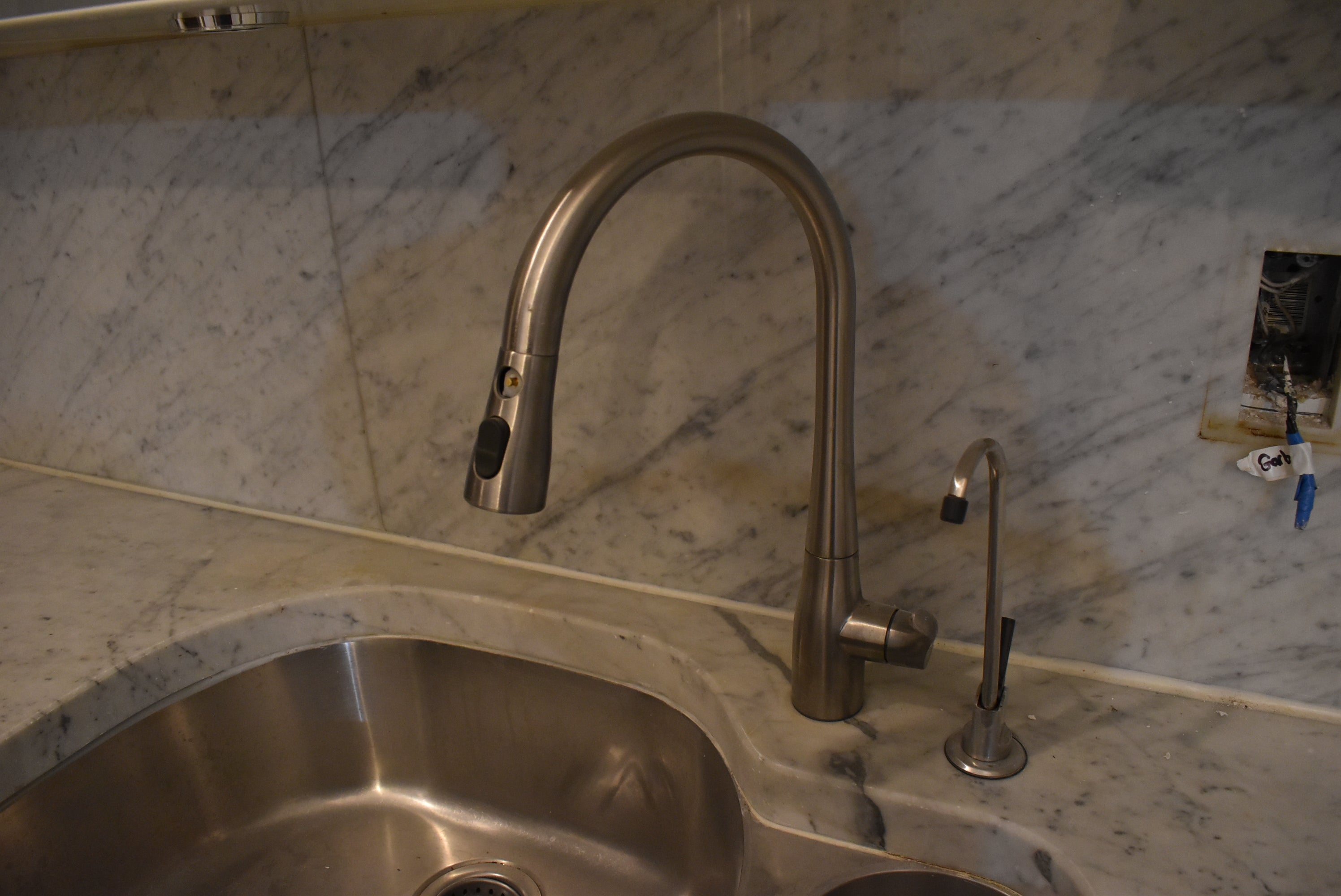 Poggenpohl Brown Toned Transitional Kitchen with Marble Countertops and Appliances