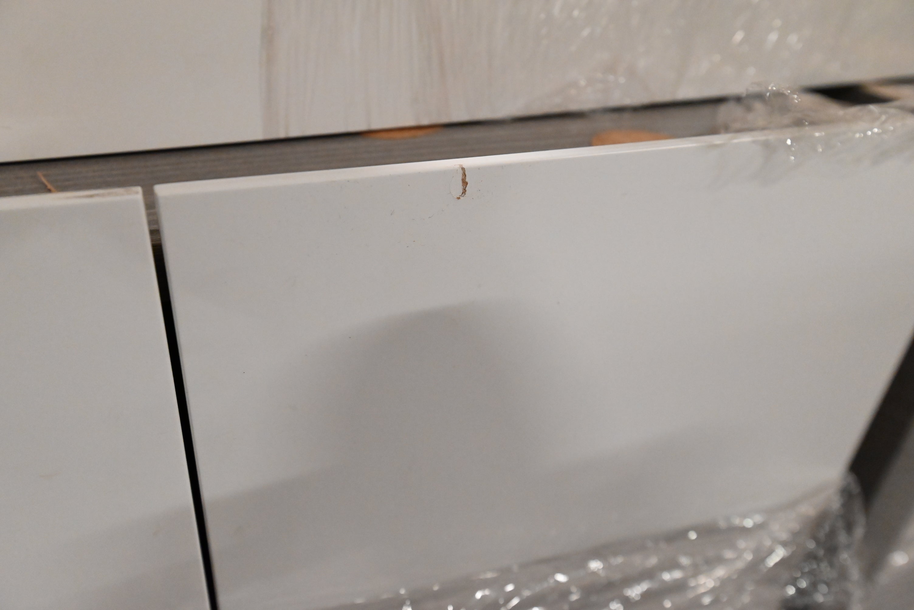 "The Strata" Modern White Textured Wood Kitchen with Island and Quartz Countertops