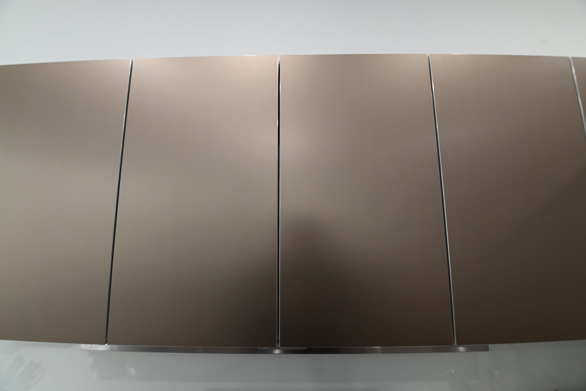 Bulthaup Modern Metallic Bronze Upper Cabinets with Glass Backsplash and Miele Hood Insert