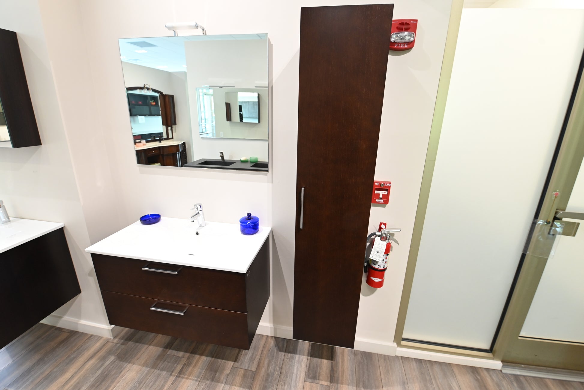 36 inch floating single basin wood veneer vanity package sitting flush against a minimalist bathroom wall backdrop
