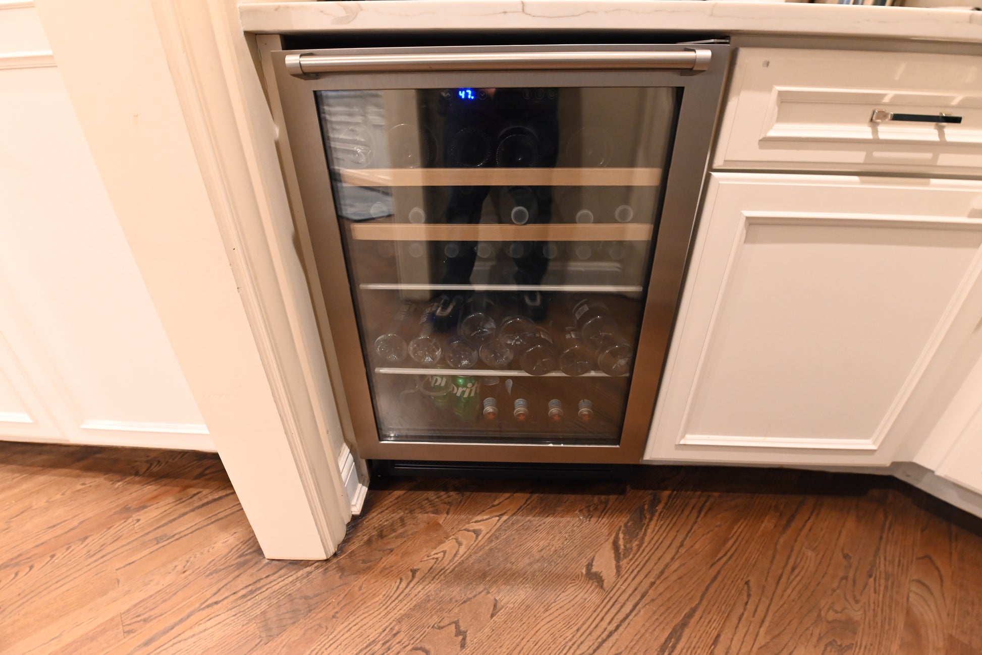 Luxury modern white shaker wet bar cabinet layout with lower storage drawers