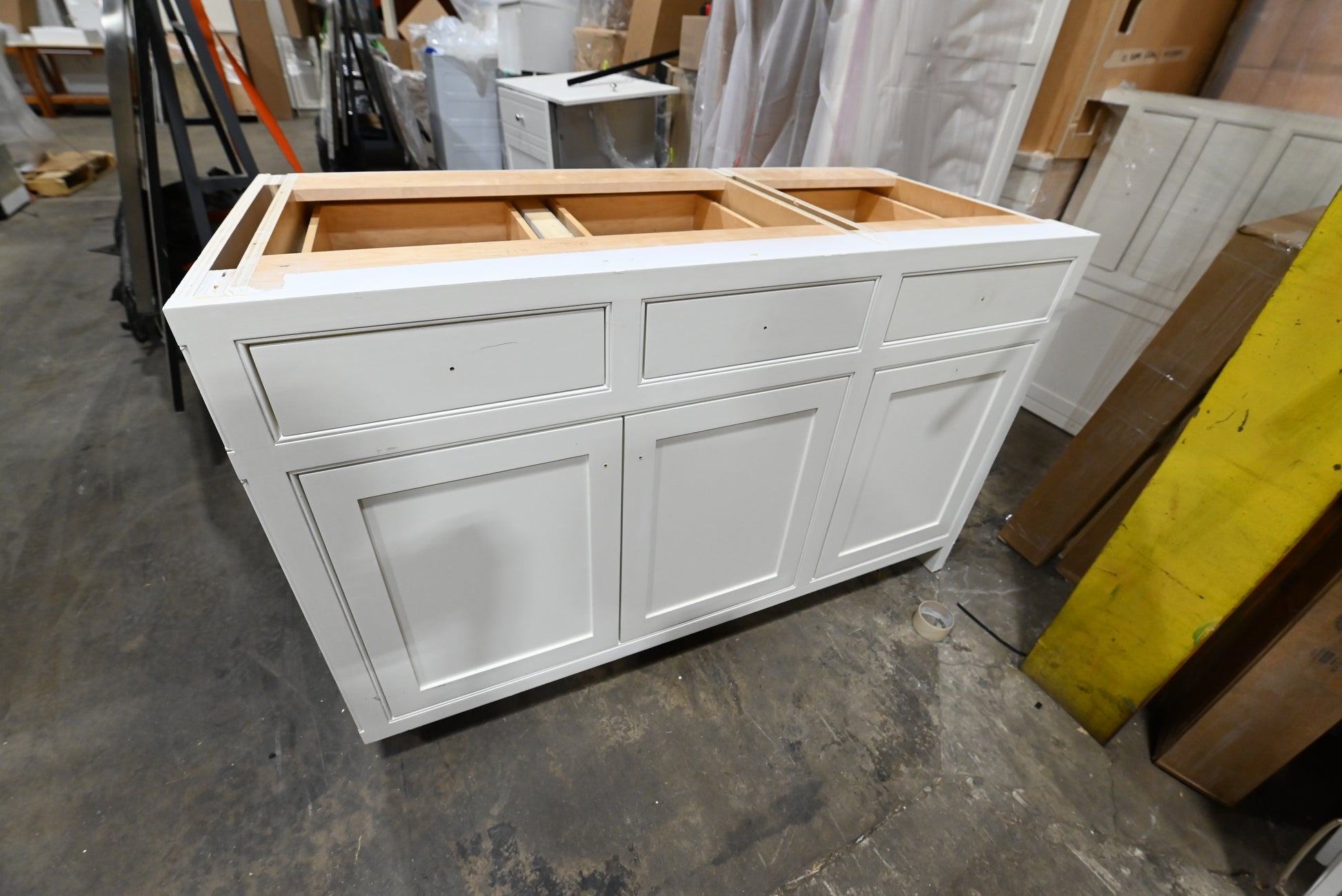 Custom traditional white partial kitchen cabinets with classic door profiles