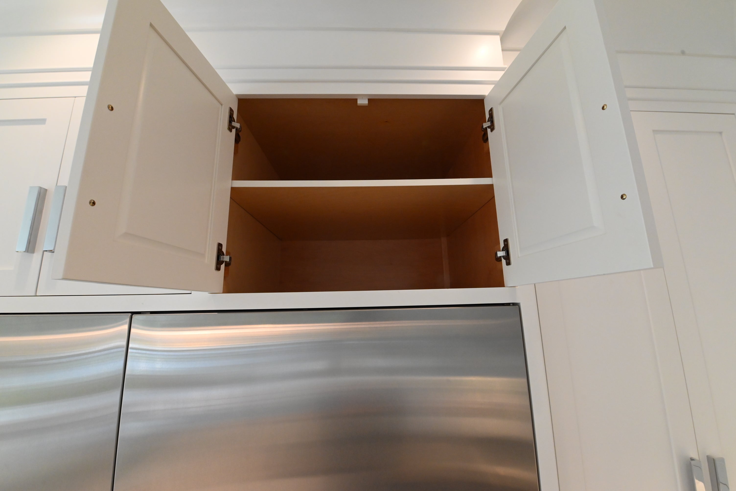 “The Pembroke” Transitional White Kitchen with Island, Wolf & Sub-Zero Appliances