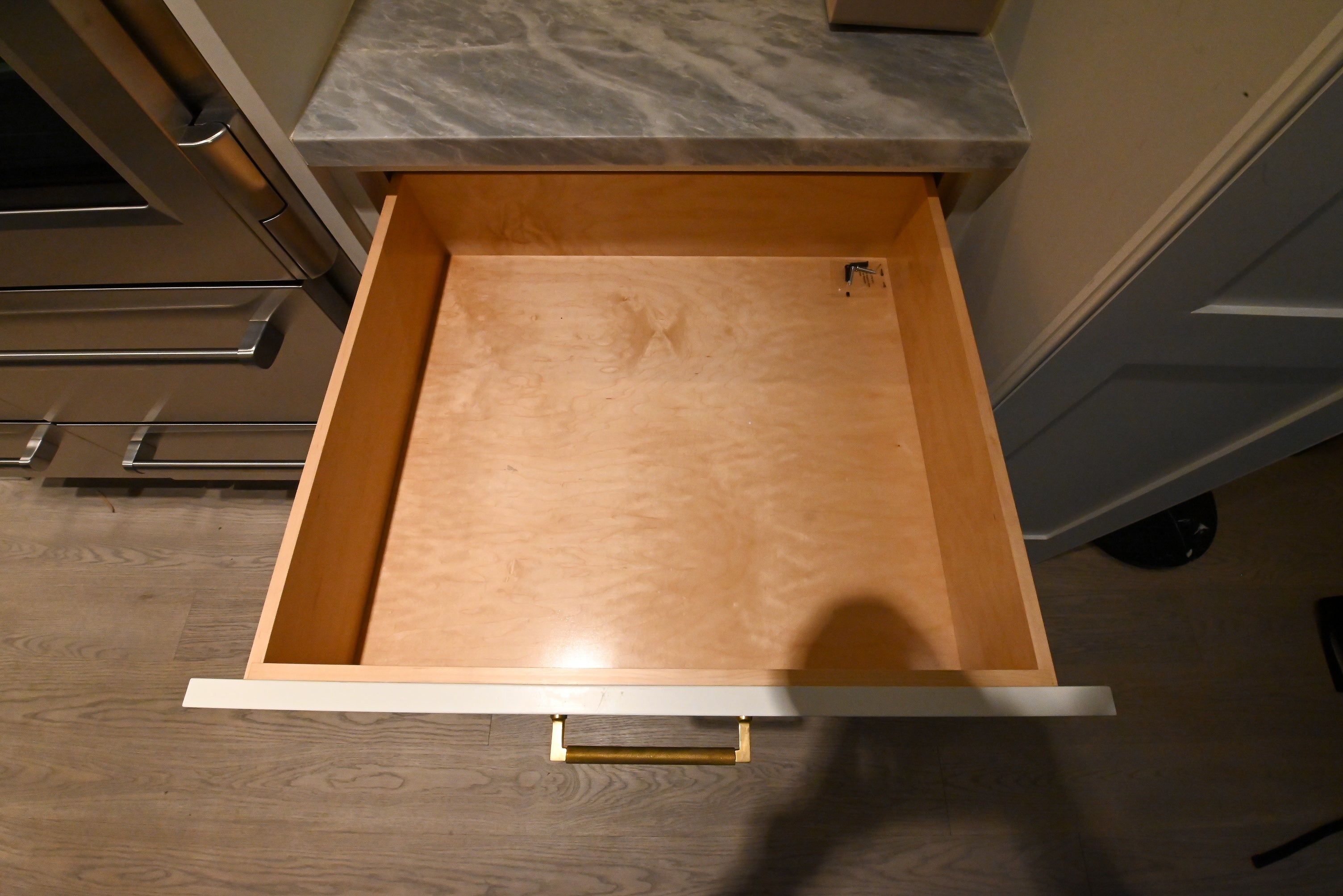 "The Windermere" Transitional White Kitchen with Island & Sub-Zero 648PROG