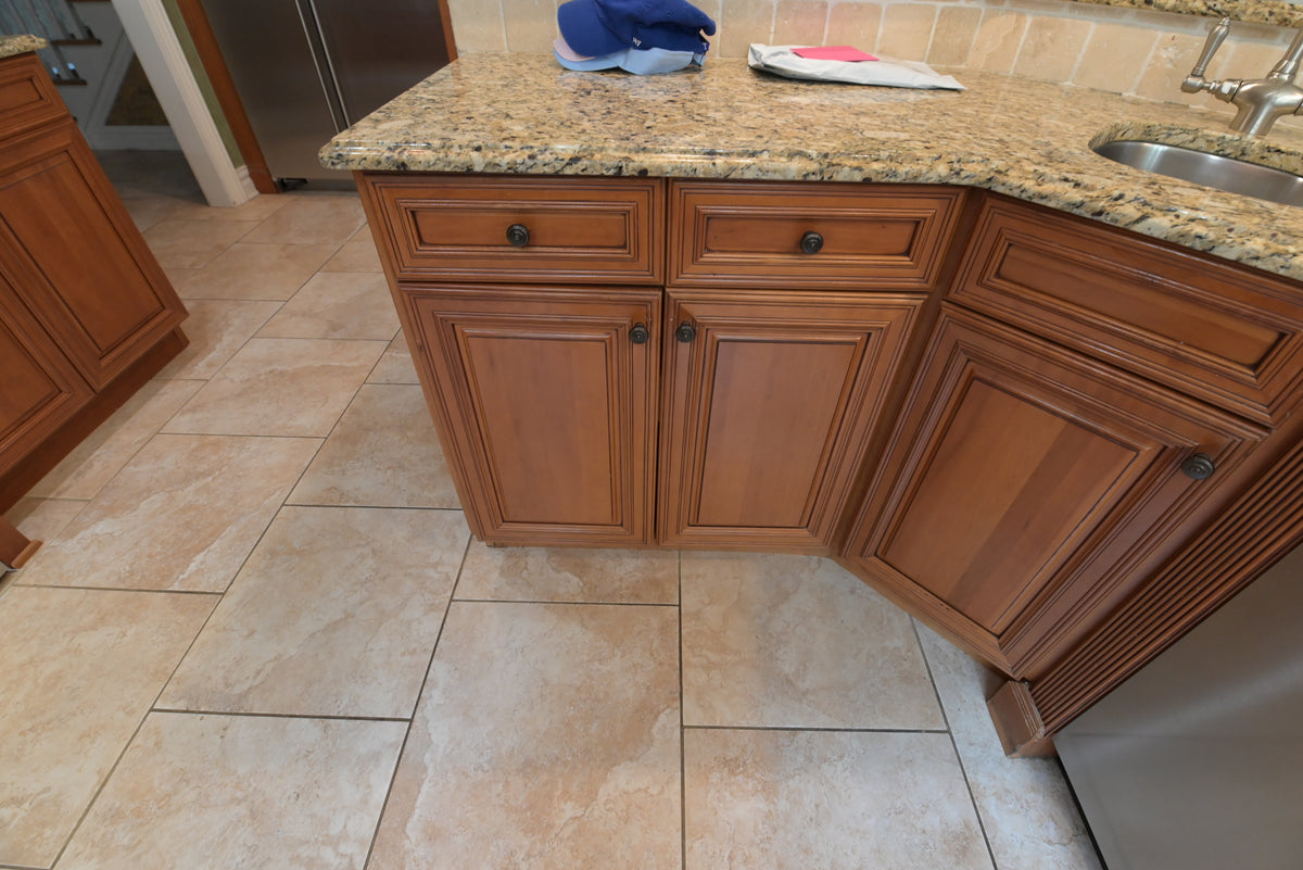 Aurora Circ traditional wooden kitchen island with raised panel doors dark knobs granite countertop and integrated sink