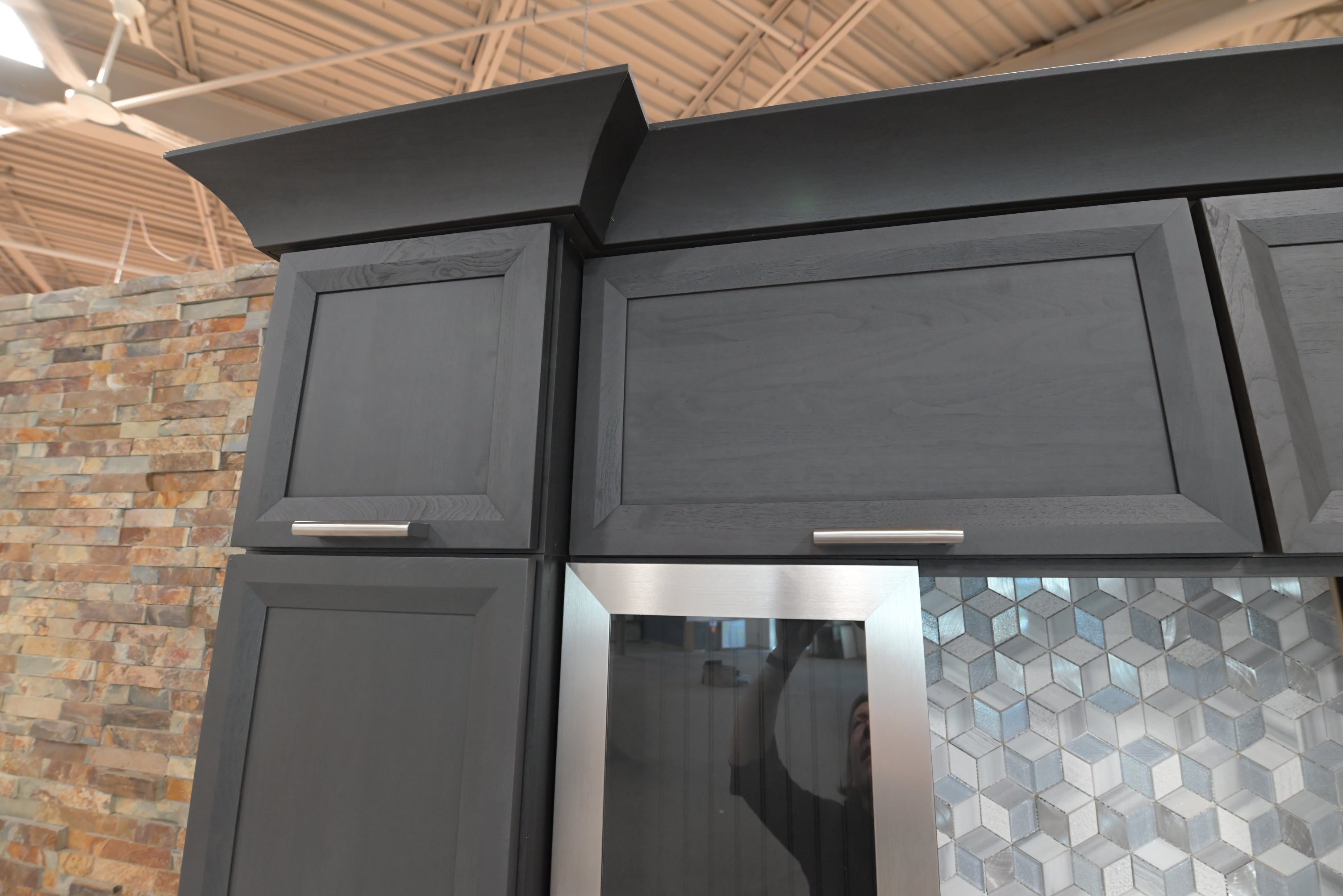 Showroom display dry bar unit with integrated beverage refrigerator and stemware racks