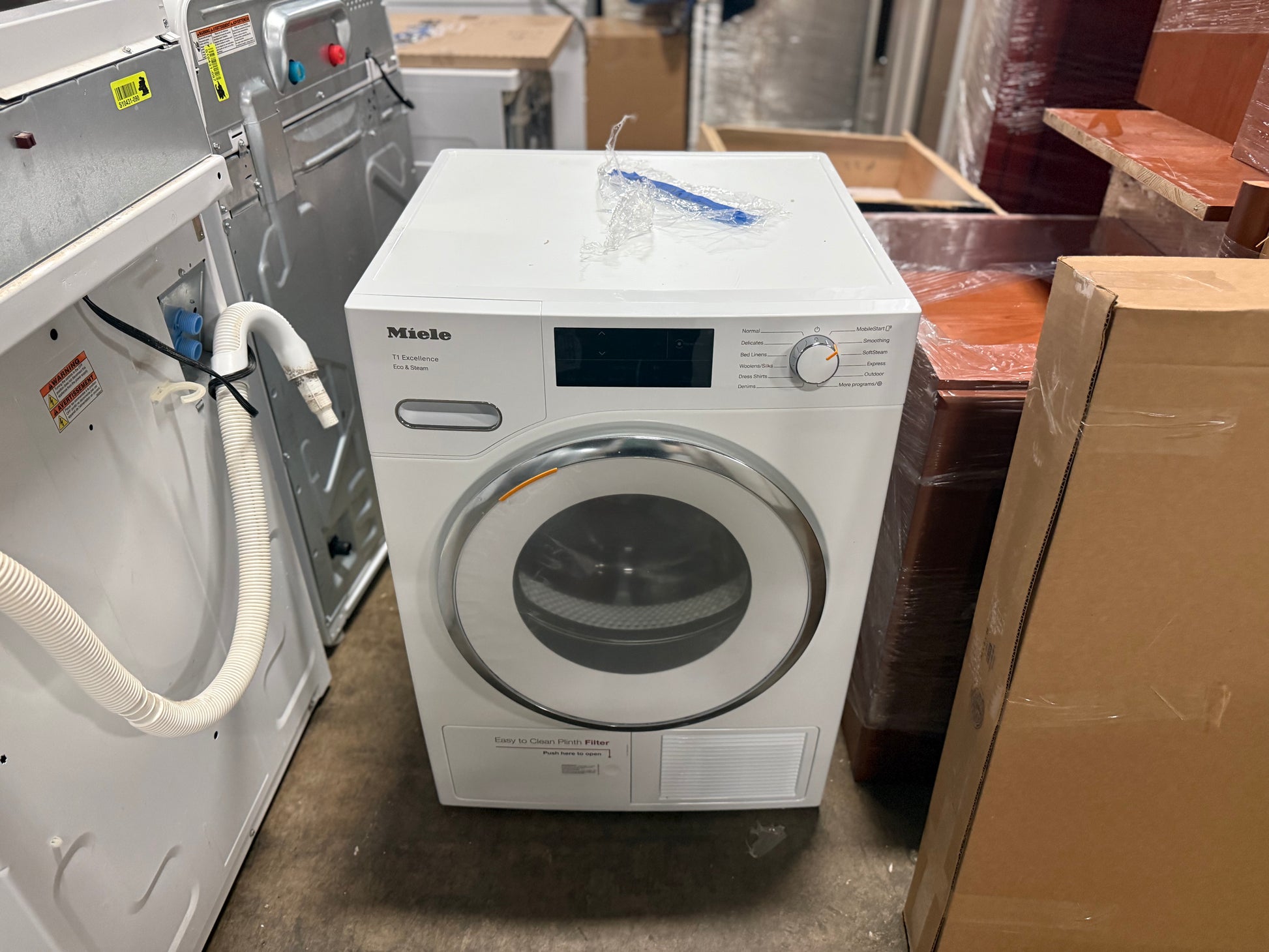 Miele 24 inch Lotus White front load washer and heat pump dryer set