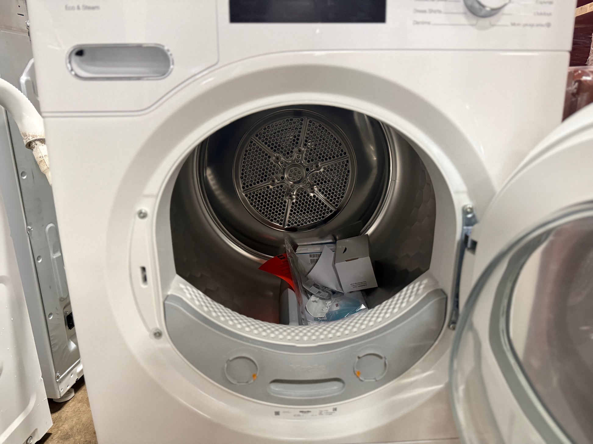 White dryer with open door showing interior