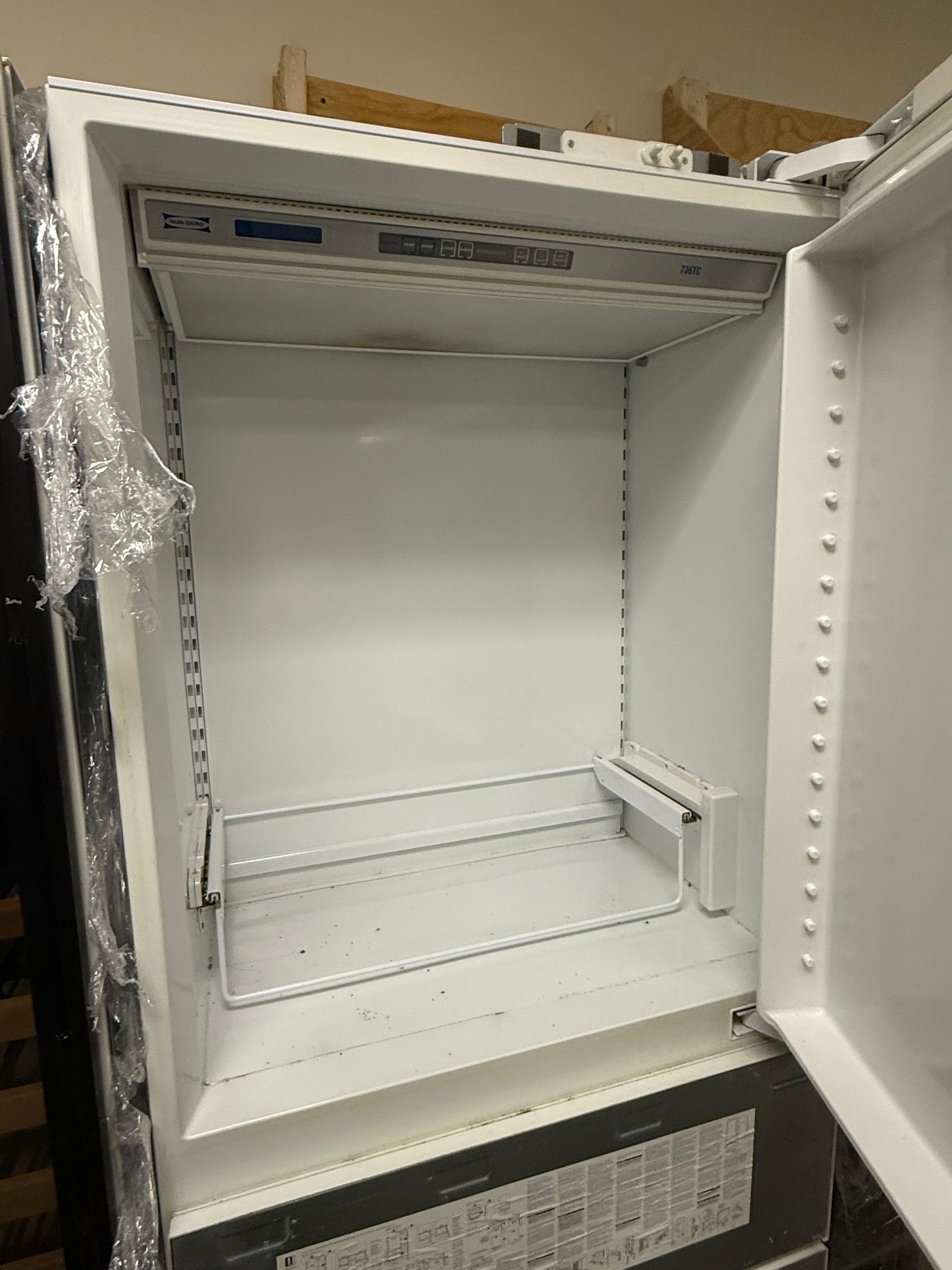 Integrated Sub-Zero 736TCI unit with double freezer drawers and ice maker