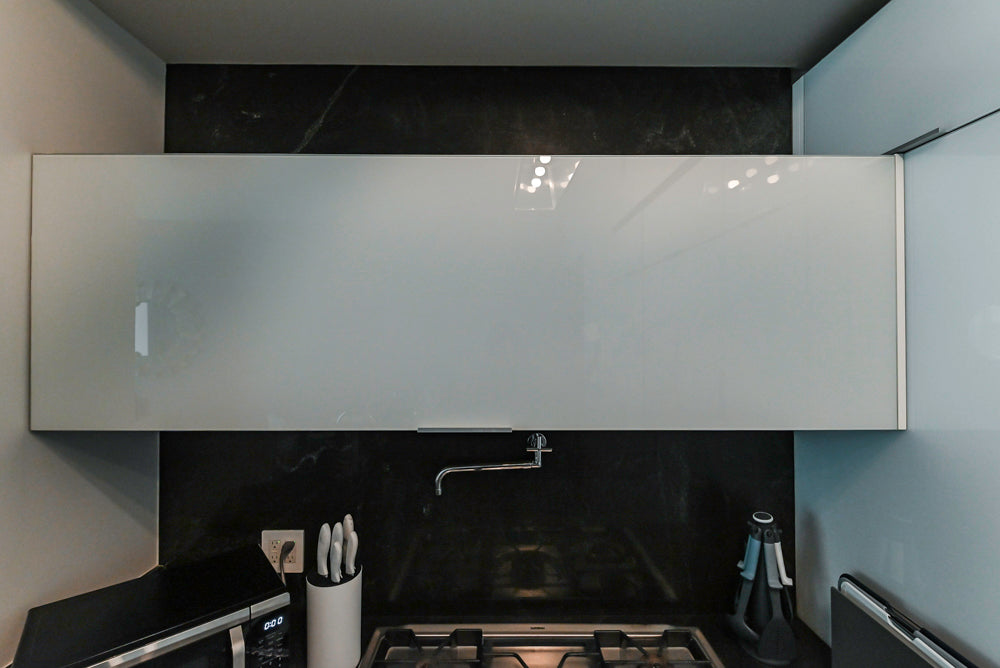 Cesar Modern Glossy White Kitchen with Black Granite Countertops & Appliances