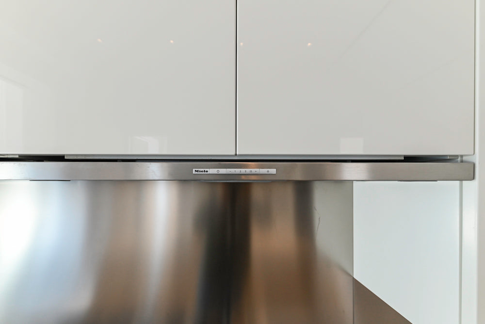 Modern Glossy White Kitchen with Island, Marble Countertops & Miele Appliances