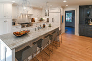 Traditional White Kitchen with Island, Appliances and Marble Countertops