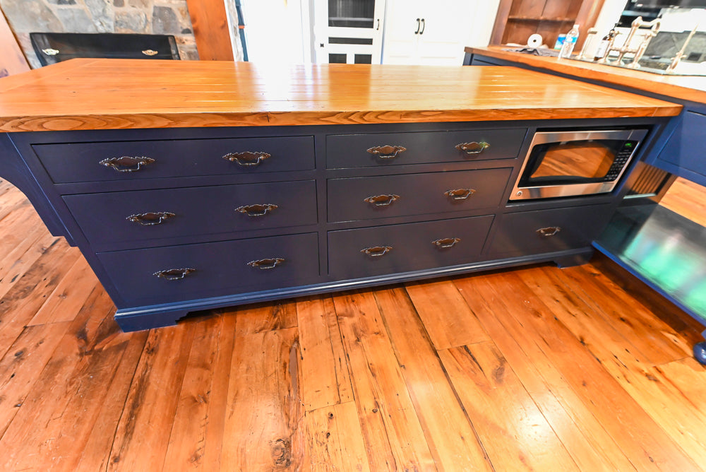 Rustic Traditional White & Navy Kitchen with Black AGA Range, Wood Top Island & Soapstone Countertops