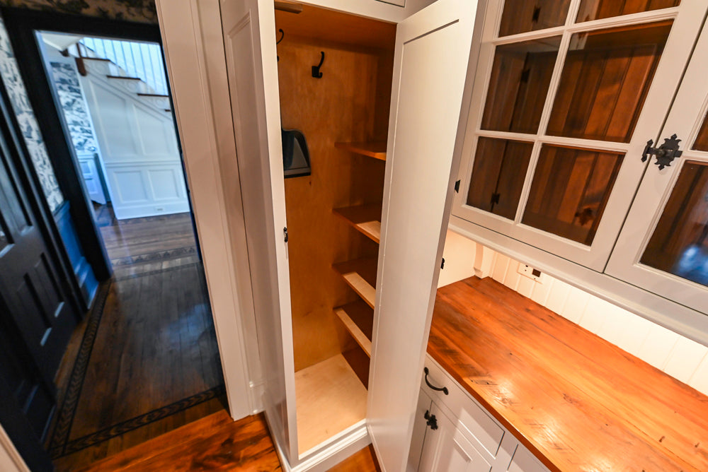 Rustic Traditional White & Navy Kitchen with Black AGA Range, Wood Top Island & Soapstone Countertops