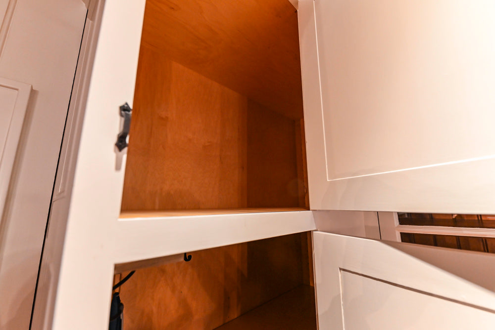 Rustic Traditional White & Navy Kitchen with Black AGA Range, Wood Top Island & Soapstone Countertops