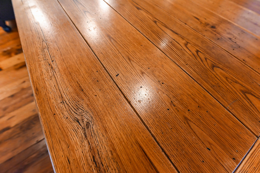 Rustic Traditional White & Navy Kitchen with Black AGA Range, Wood Top Island & Soapstone Countertops