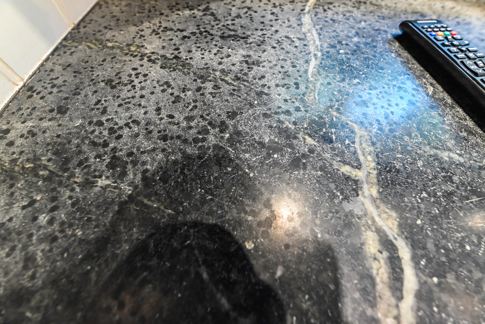 Rustic Traditional White & Navy Kitchen with Black AGA Range, Wood Top Island & Soapstone Countertops