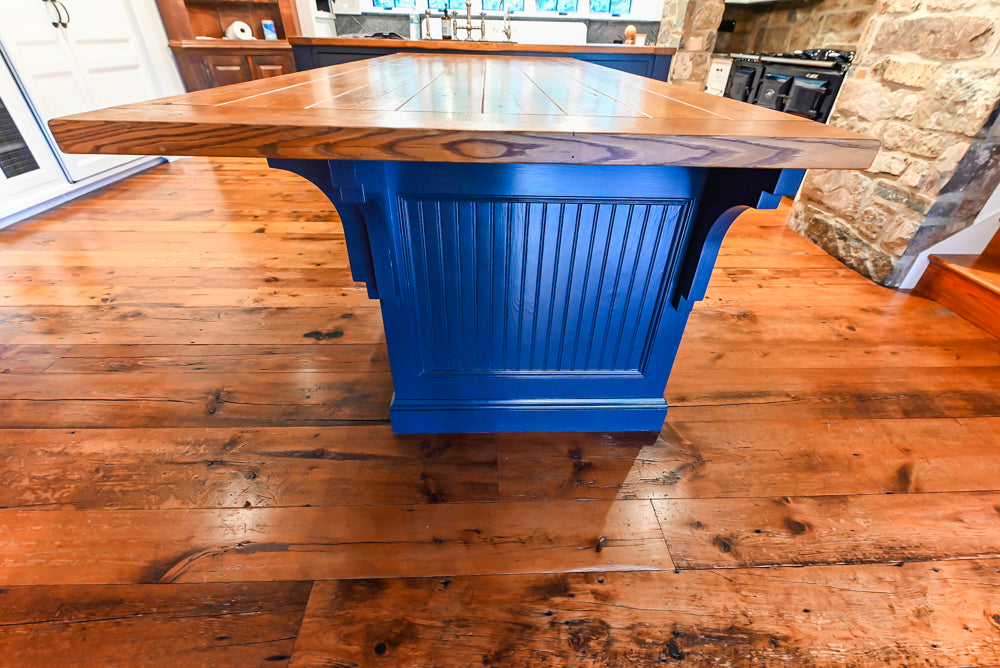 Rustic Traditional White & Navy Kitchen with Black AGA Range, Wood Top Island & Soapstone Countertops