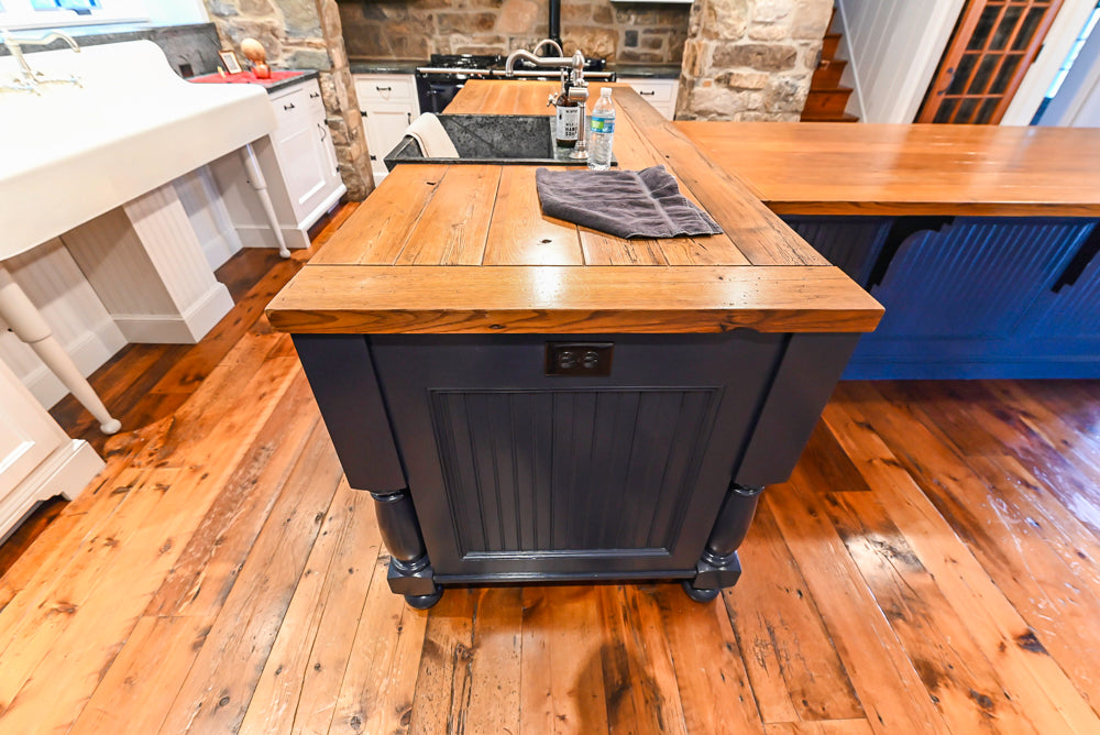 Rustic Traditional White & Navy Kitchen with Black AGA Range, Wood Top Island & Soapstone Countertops