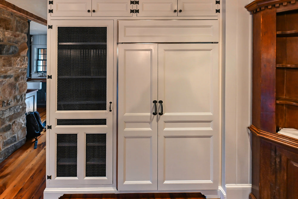 Rustic Traditional White & Navy Kitchen with Black AGA Range, Wood Top Island & Soapstone Countertops