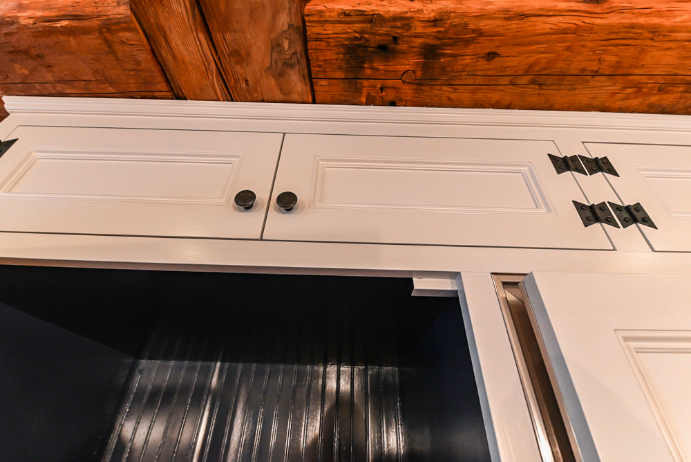 Rustic Traditional White & Navy Kitchen with Black AGA Range, Wood Top Island & Soapstone Countertops