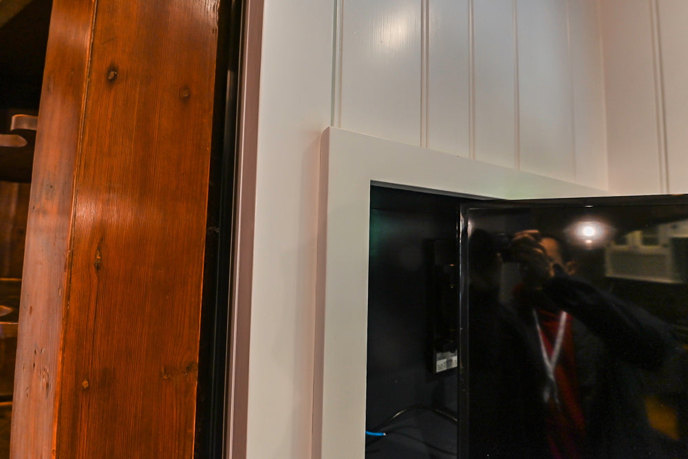 Rustic Traditional White & Navy Kitchen with Black AGA Range, Wood Top Island & Soapstone Countertops