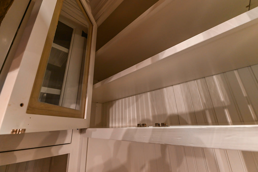 Rustic Traditional White & Navy Kitchen with Black AGA Range, Wood Top Island & Soapstone Countertops